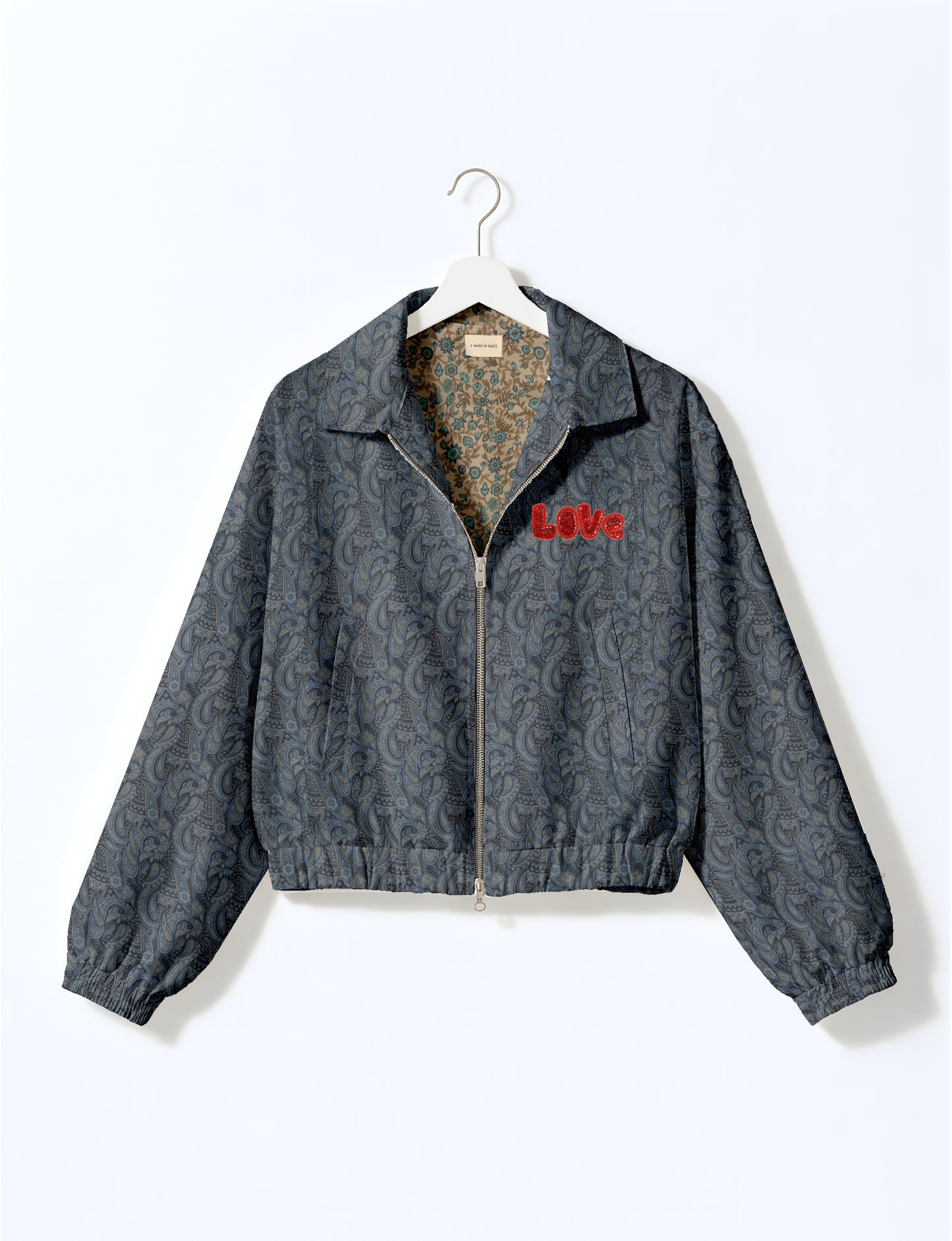 Love Bomber Jacket made from recycled fabric, featuring hand-stitched Aari embroidery. A unique piece of zero-waste clothing, part of the circular fashion movement. Designed with upcycled materials for a stylish yet environmentally friendly clothing choice.