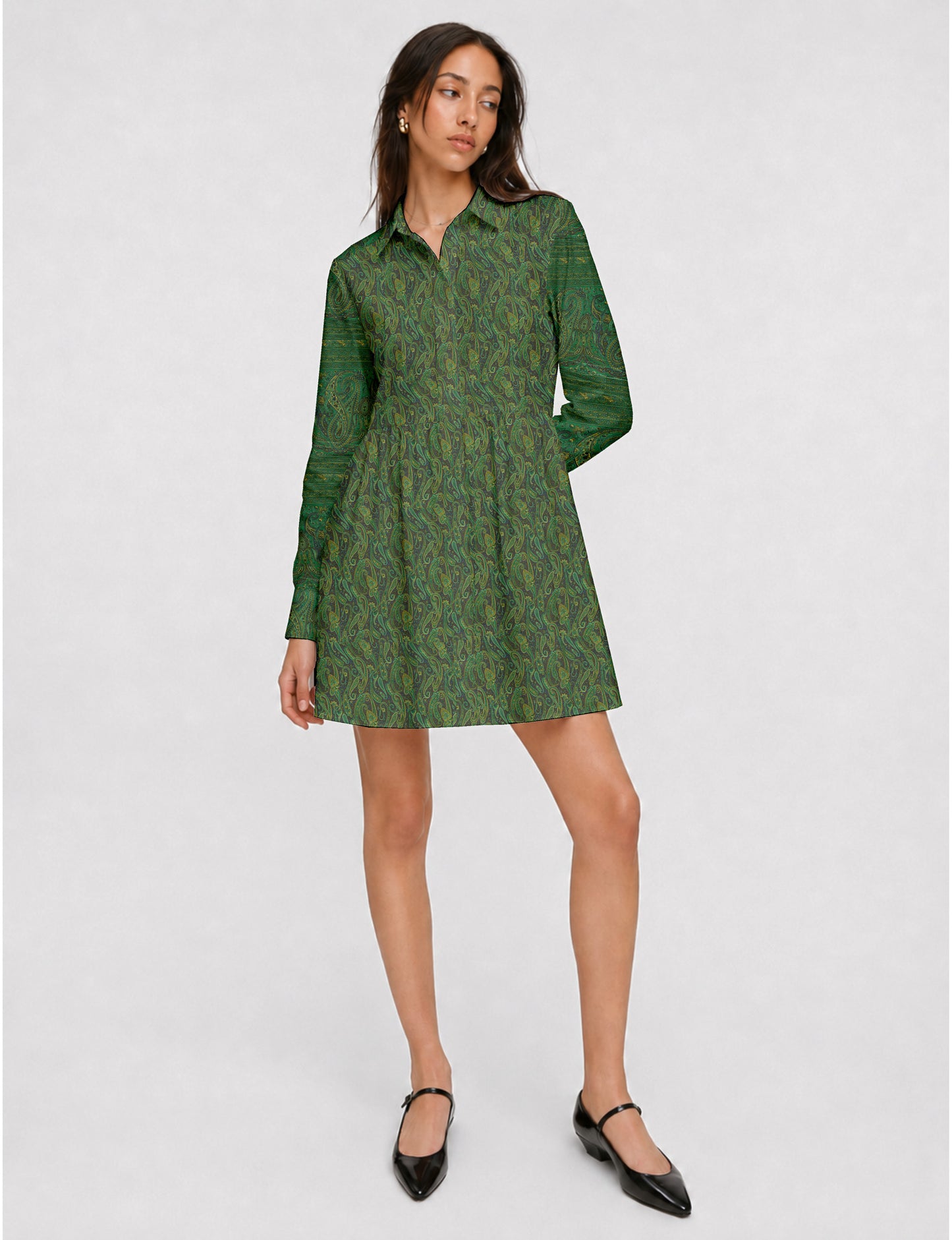 Short shirt dress with a relaxed A-line silhouette, point collar, partial button placket, gathered waist, side pockets, and full-length cuffed sleeves.