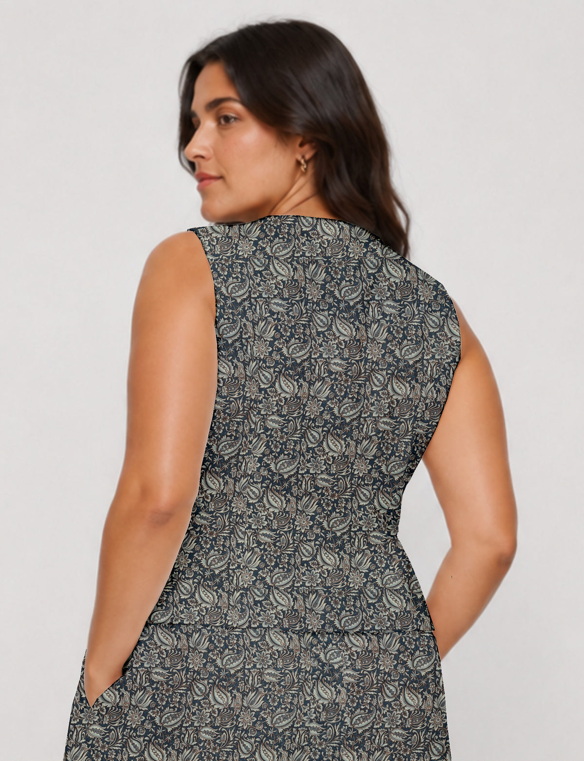 Women's fitted waistcoat with V-neck, single-breasted button closure, tailored silhouette, and pointed hem in sustainable fashion.