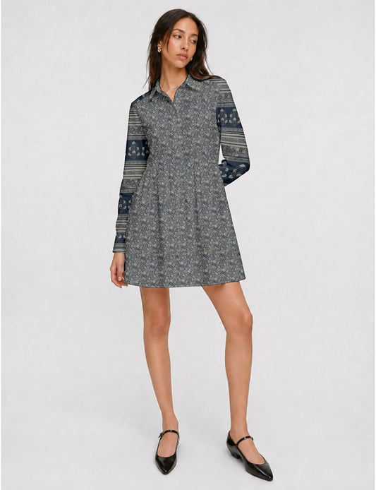 Short shirt dress with a relaxed A-line silhouette, point collar, partial button placket, gathered waist, side pockets, and full-length cuffed sleeves.