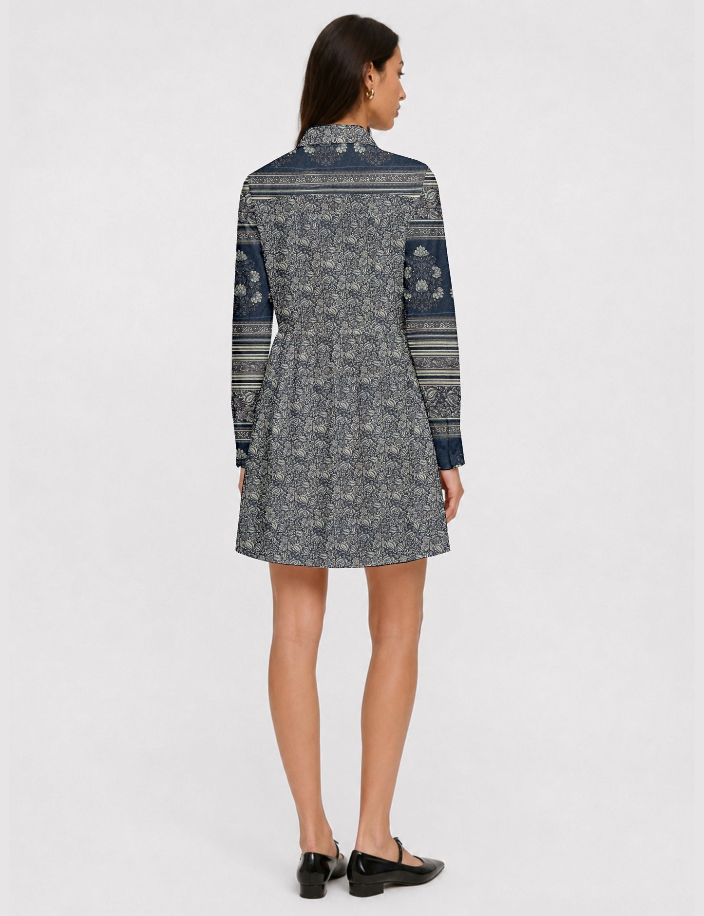 Short shirt dress with a relaxed A-line silhouette, point collar, partial button placket, gathered waist, side pockets, and full-length cuffed sleeves.