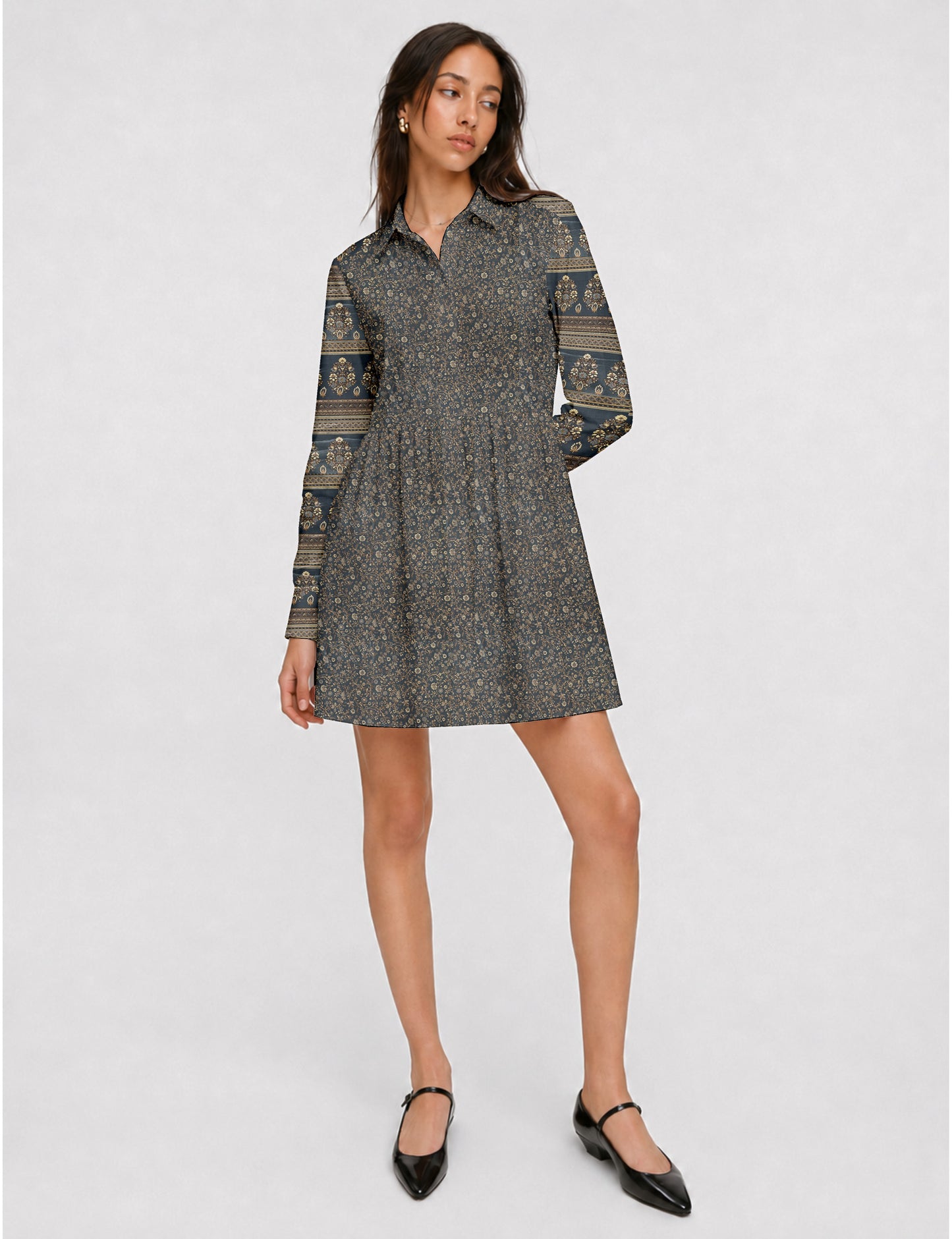 Short shirt dress with a relaxed A-line silhouette, point collar, partial button placket, gathered waist, side pockets, and full-length cuffed sleeves.