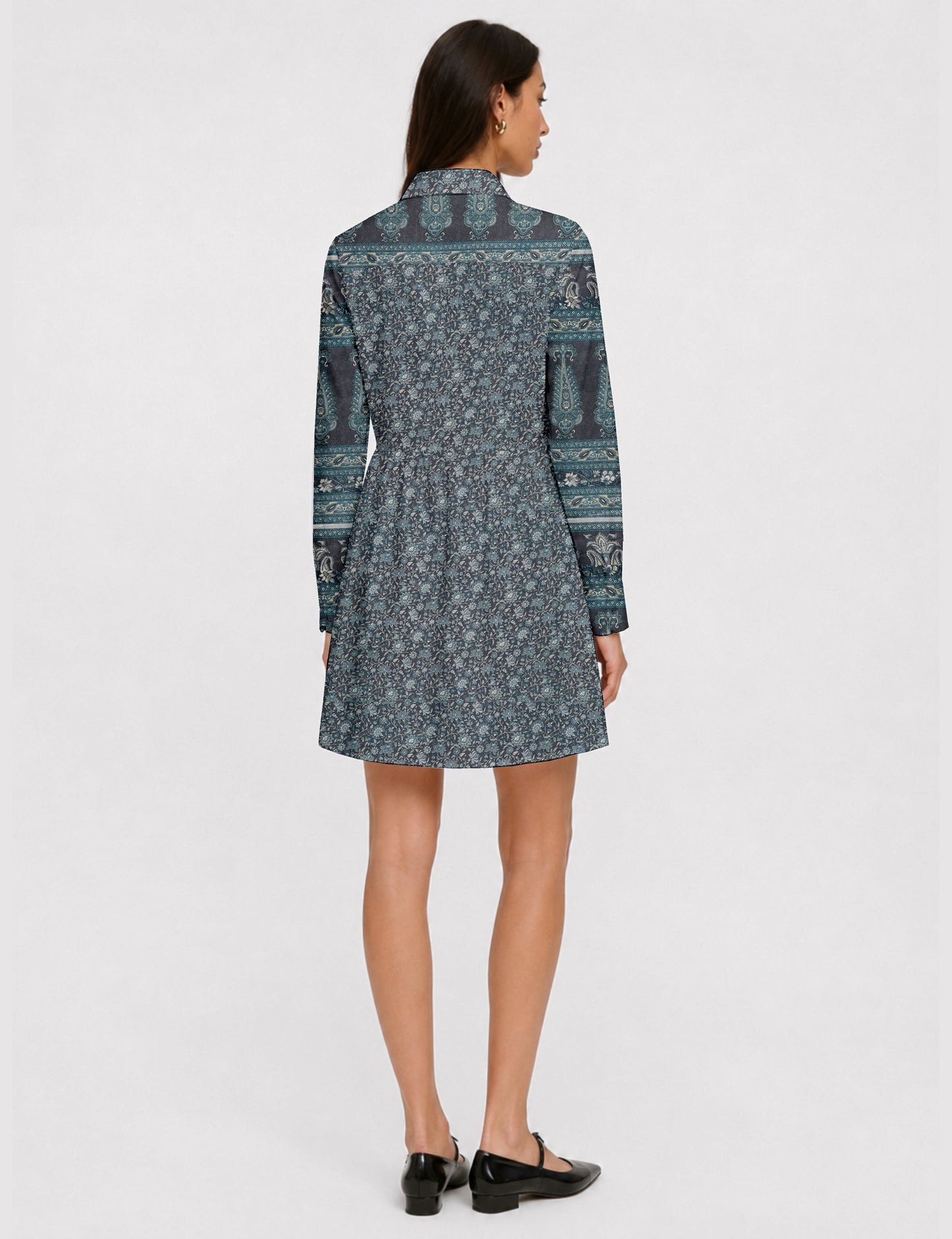 Short shirt dress with a relaxed A-line silhouette, point collar, partial button placket, gathered waist, side pockets, and full-length cuffed sleeves.
