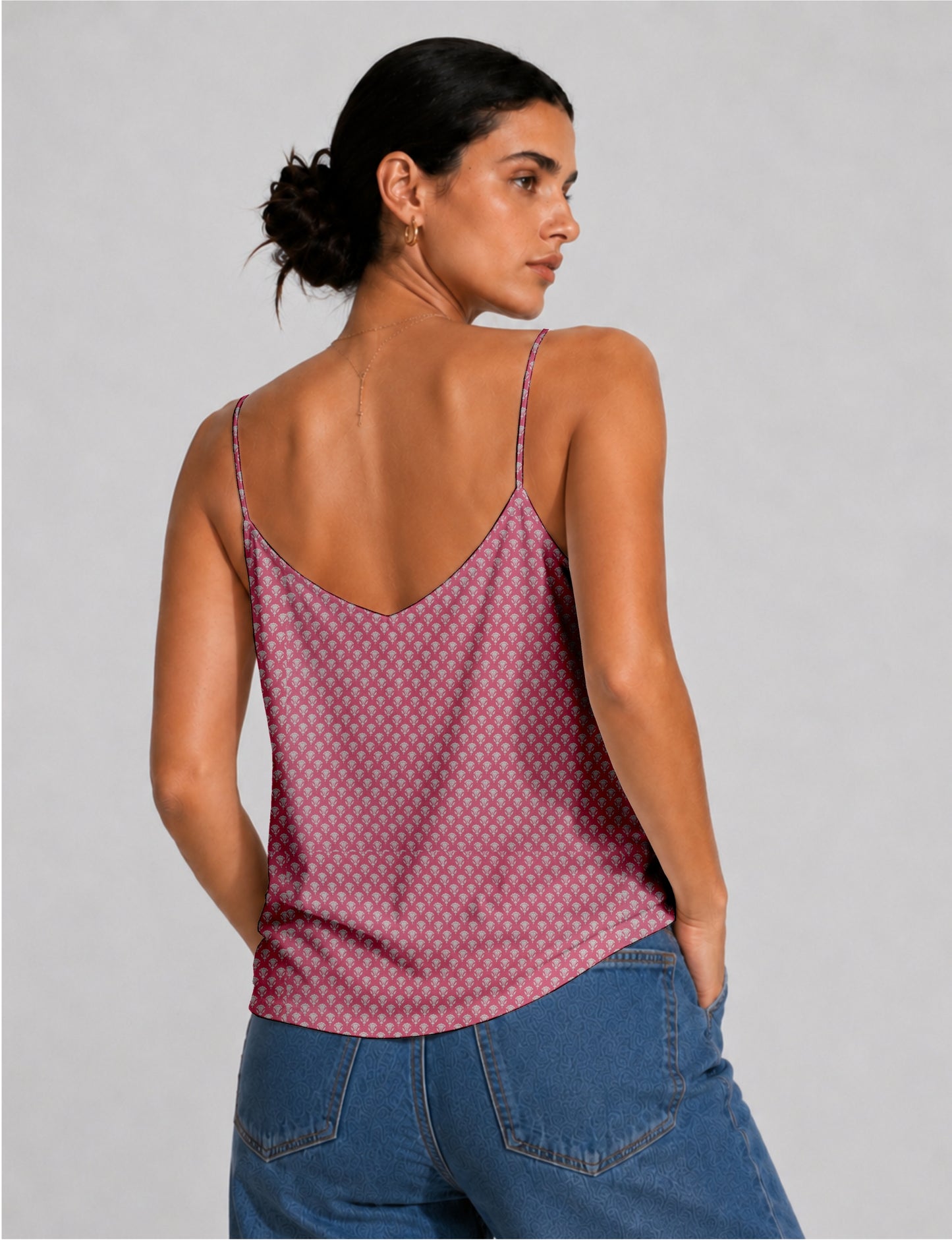 Women's sleeveless slip top with a relaxed straight fit, soft V-neckline, deep V-back, and delicate spaghetti straps.