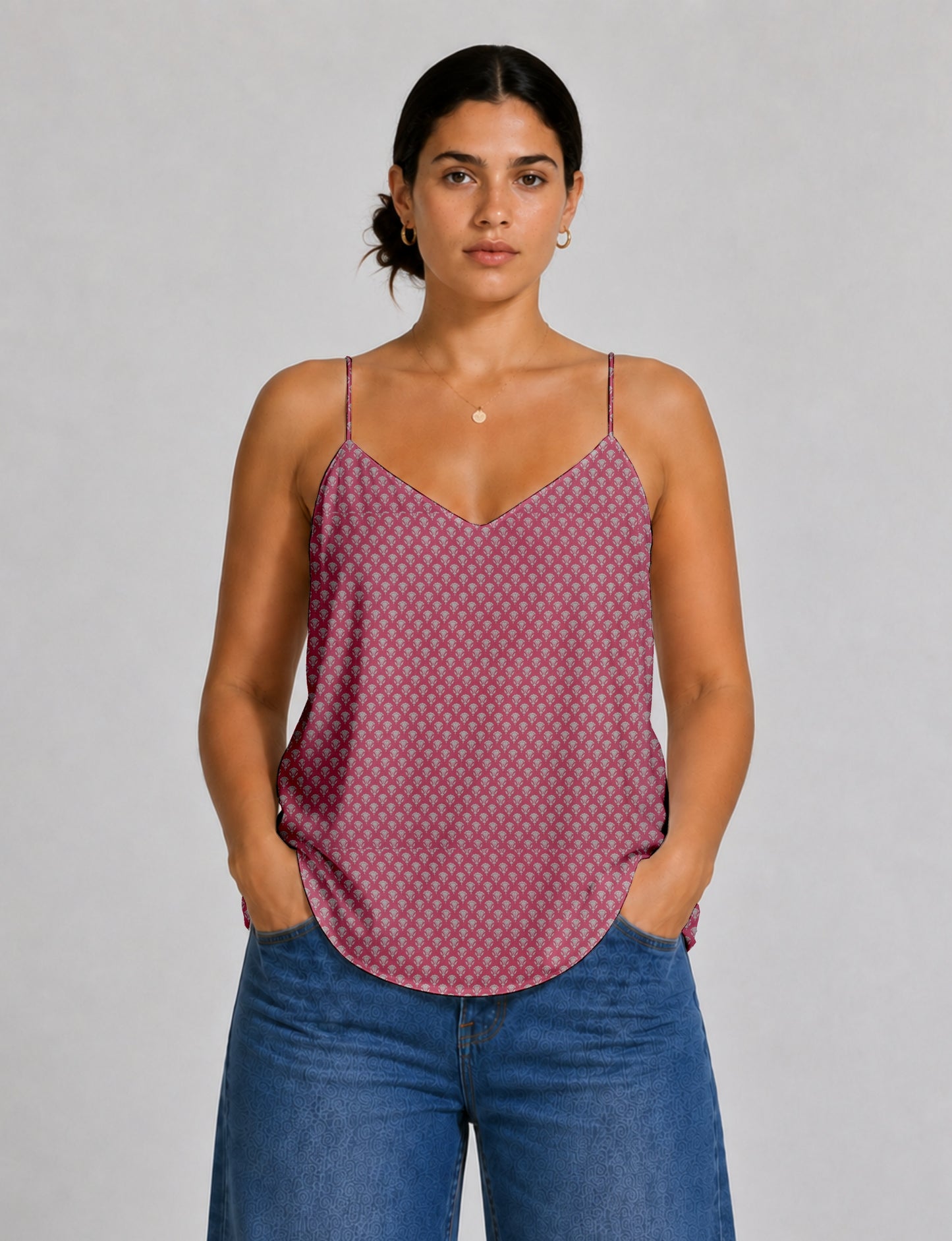 Women's sleeveless slip top with a relaxed straight fit, soft V-neckline, deep V-back, and delicate spaghetti straps.