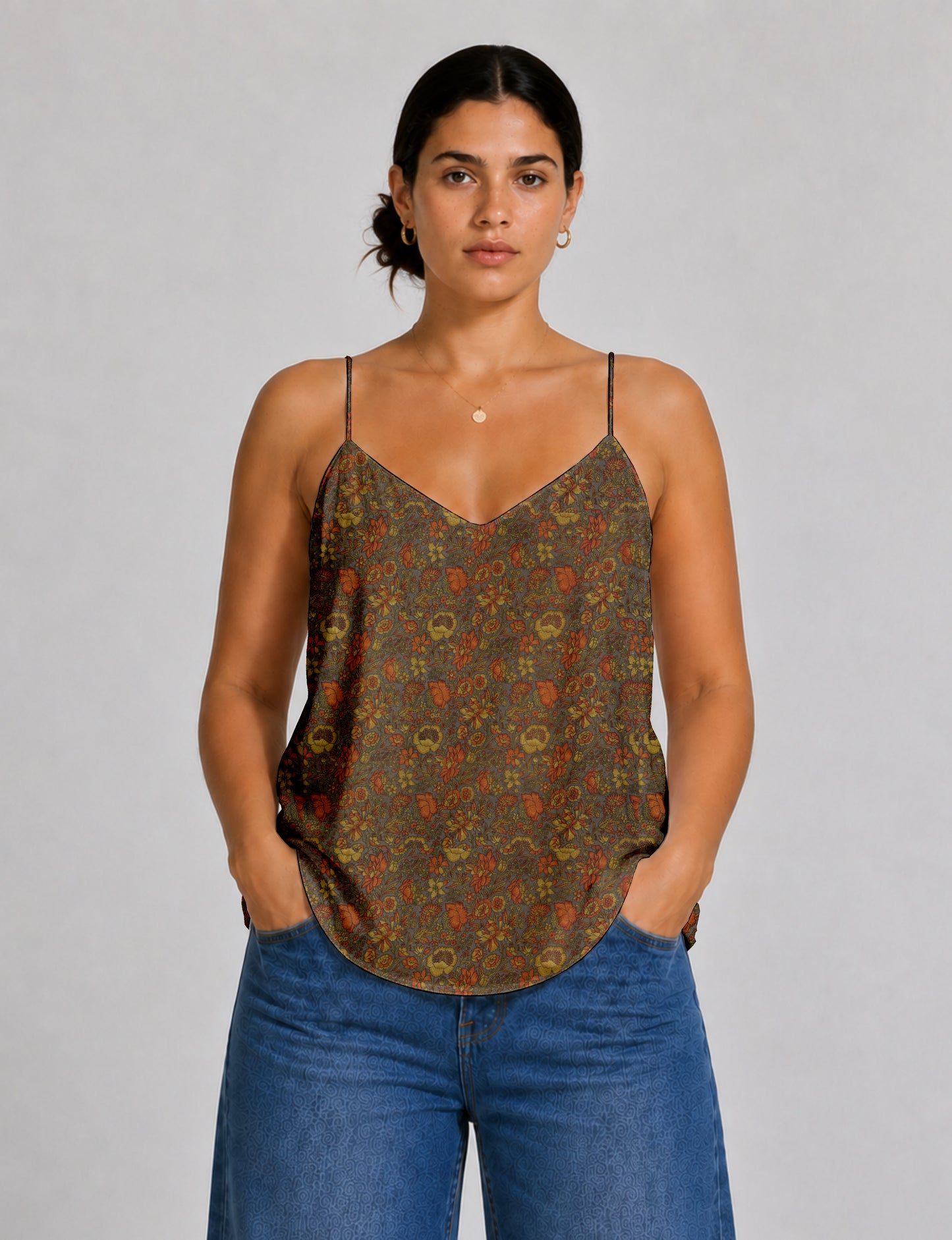 Women's sleeveless slip top with a relaxed straight fit, soft V-neckline, deep V-back, and delicate spaghetti straps.