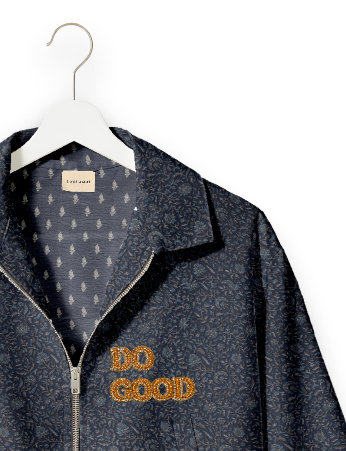 Gold cropped DO GOOD bomber jacket featuring hand-embroidered lettering on the left chest, contrasting inner lining and two functional pockets.