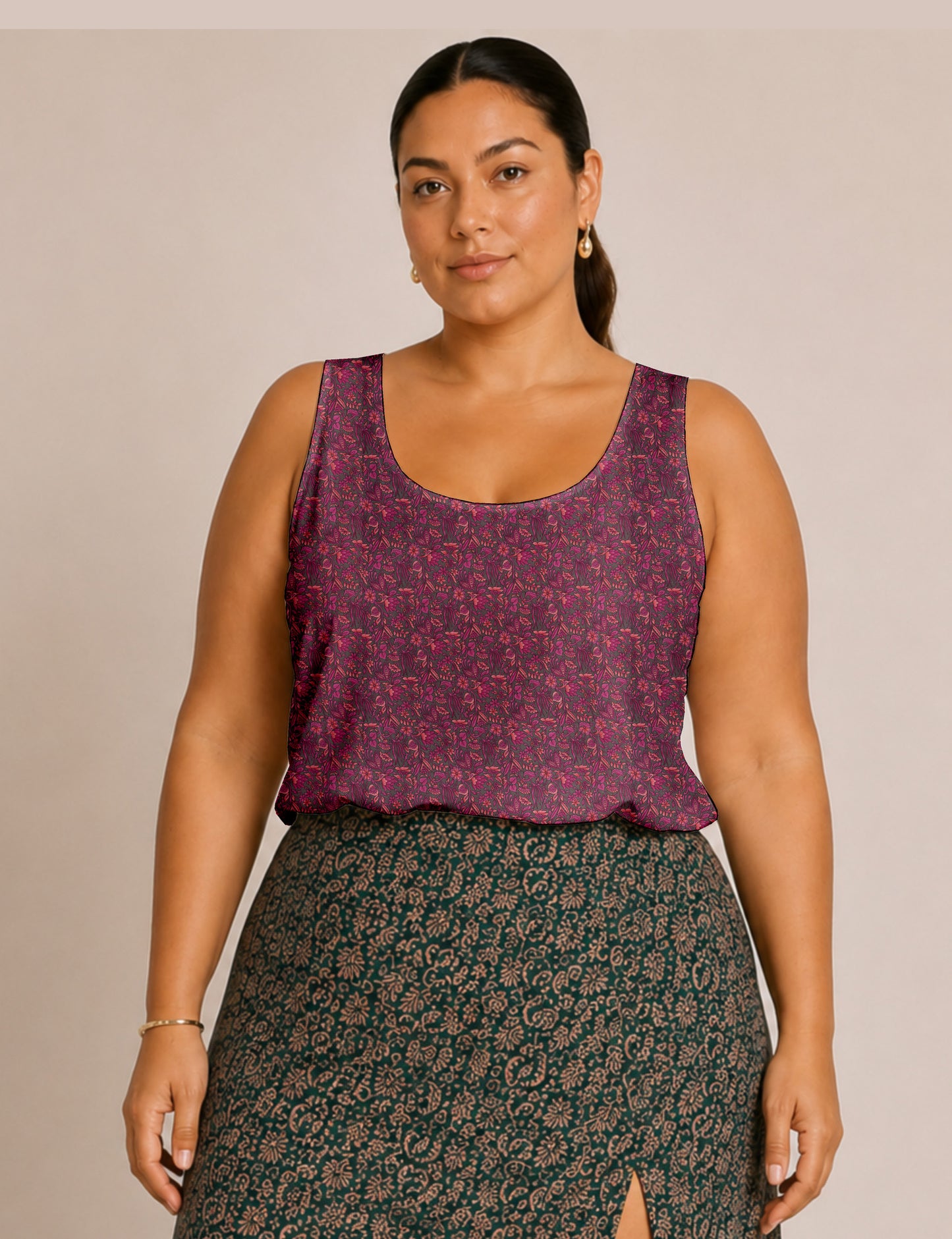 Women's sleeveless blouse with a relaxed straight fit, wide scoop neckline, deep scoop back, and hip-length silhouette.