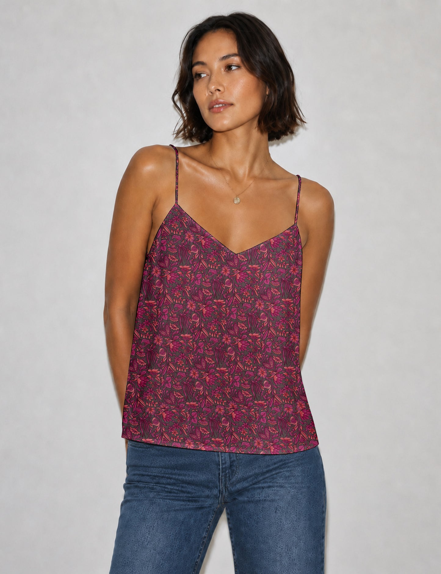 Women's sleeveless slip top with a relaxed straight fit, soft V-neckline, deep V-back, and delicate spaghetti straps.