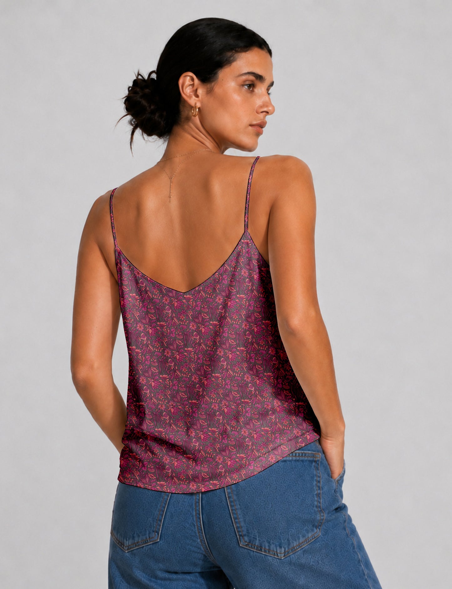 Women's sleeveless slip top with a relaxed straight fit, soft V-neckline, deep V-back, and delicate spaghetti straps.
