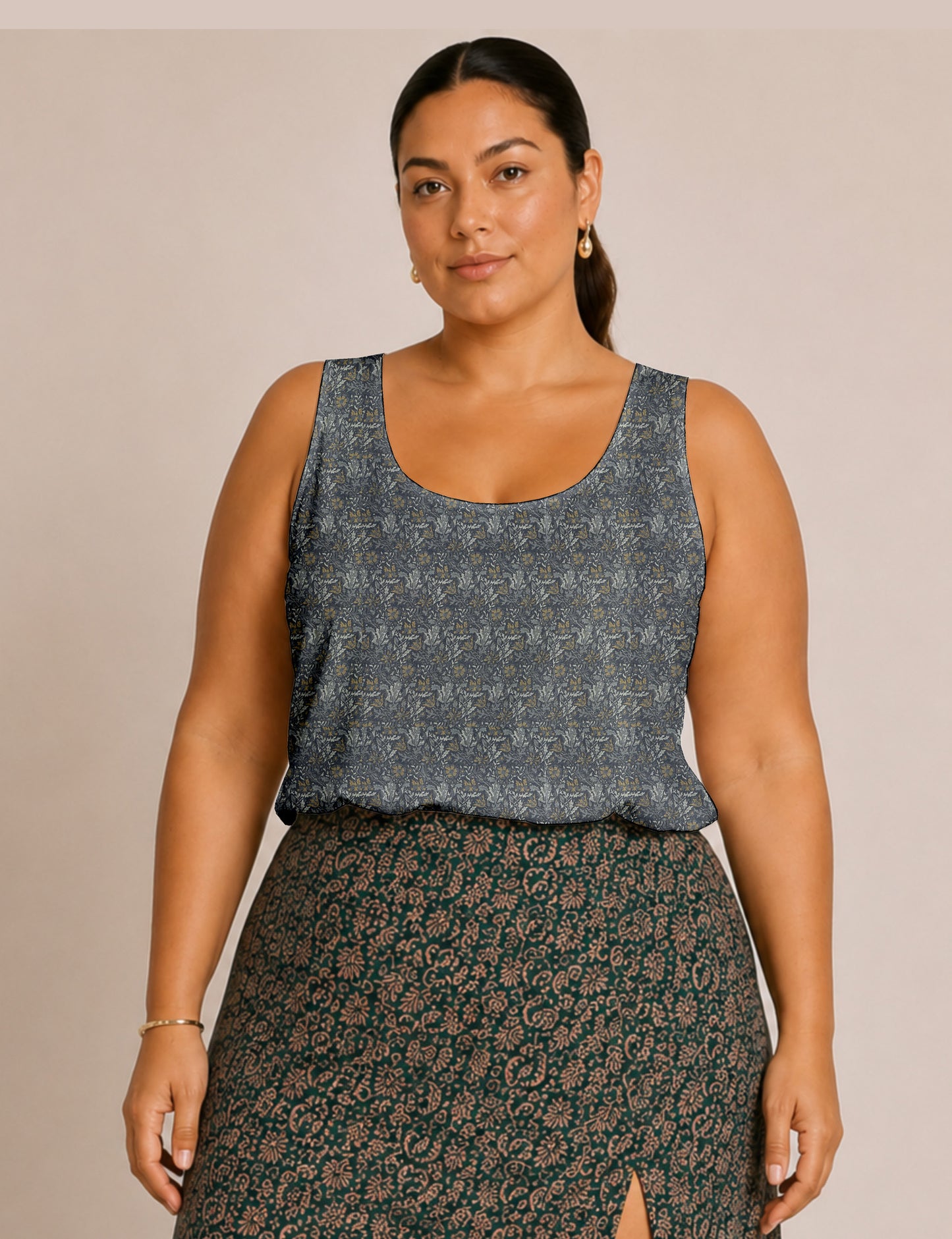 Women's sleeveless blouse with a relaxed straight fit, wide scoop neckline, deep scoop back, and hip-length silhouette.