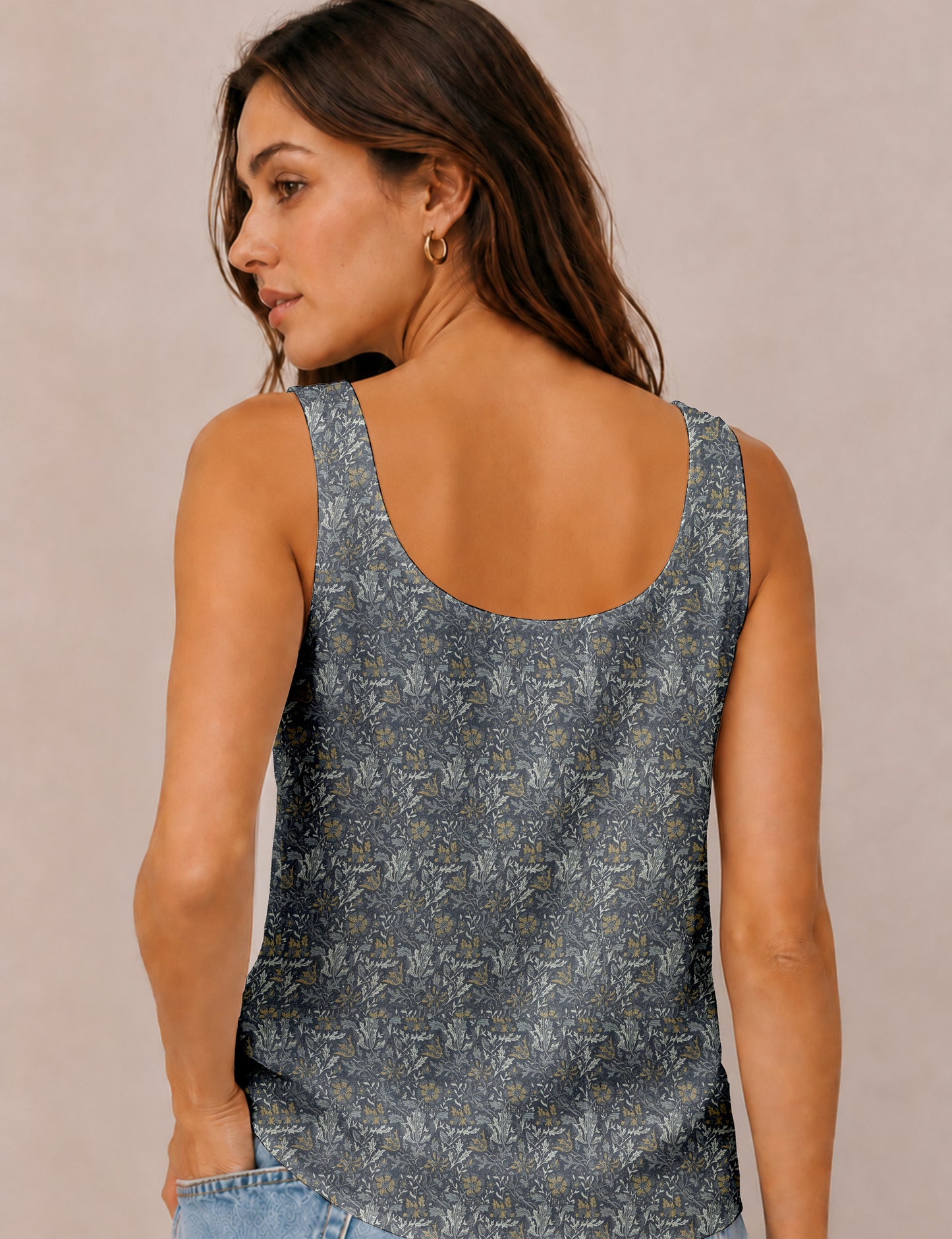 Women's sleeveless blouse with a relaxed straight fit, wide scoop neckline, deep scoop back, and hip-length silhouette.