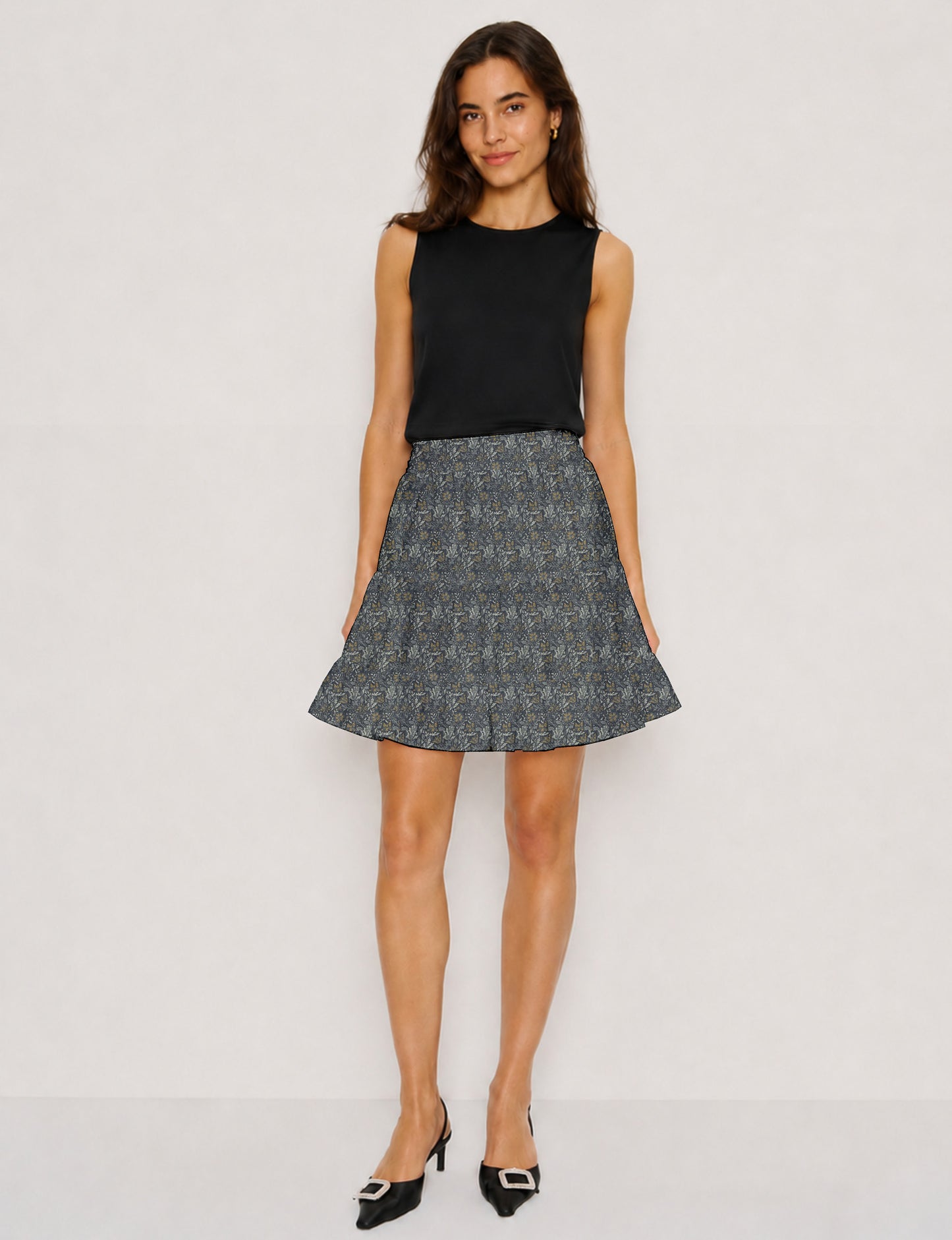 Short tiered skirt with a fitted waistband, knife pleats, softly flared silhouette, side seam pockets, and above-the-knee length.