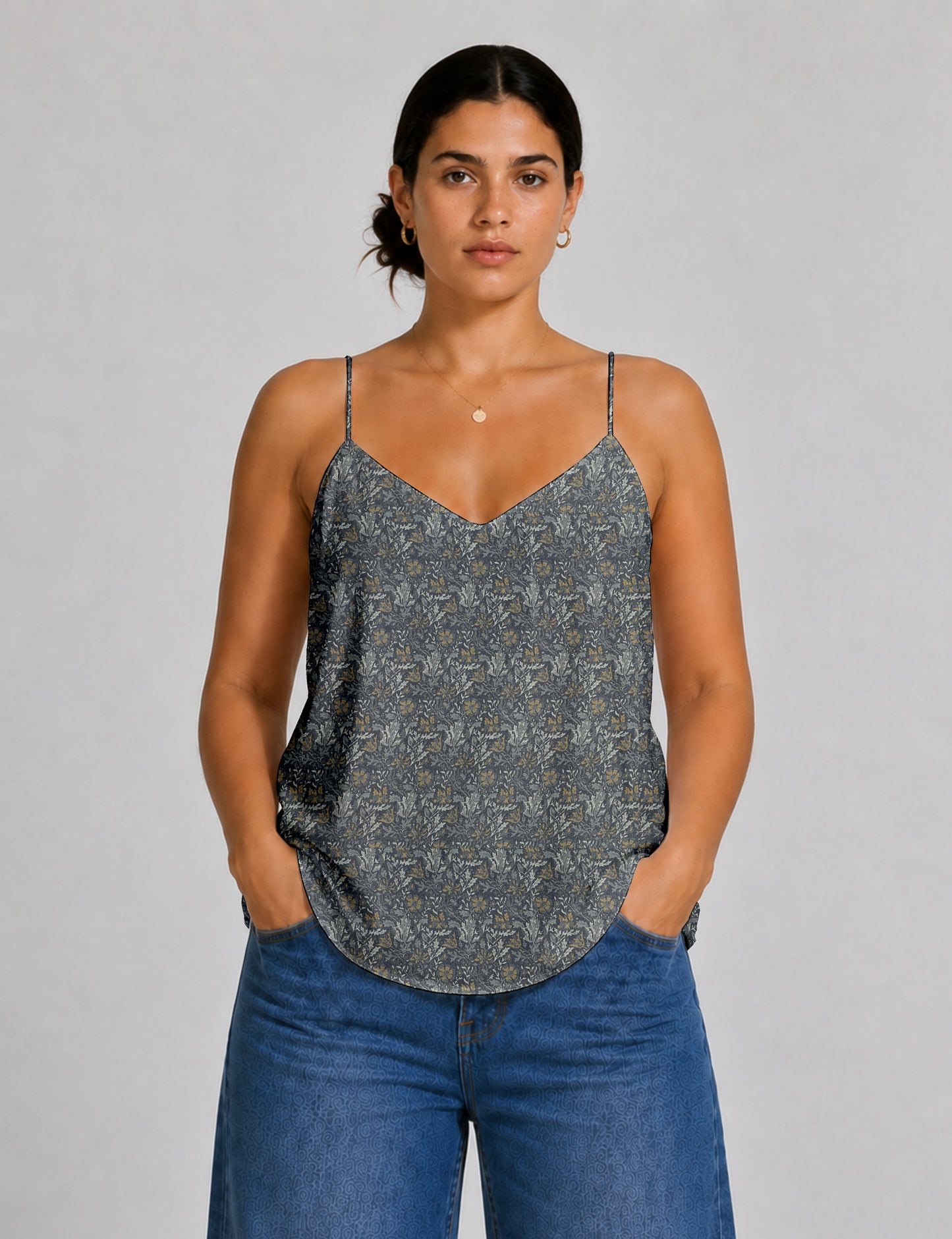 Women's sleeveless slip top with a relaxed straight fit, soft V-neckline, deep V-back, and delicate spaghetti straps.