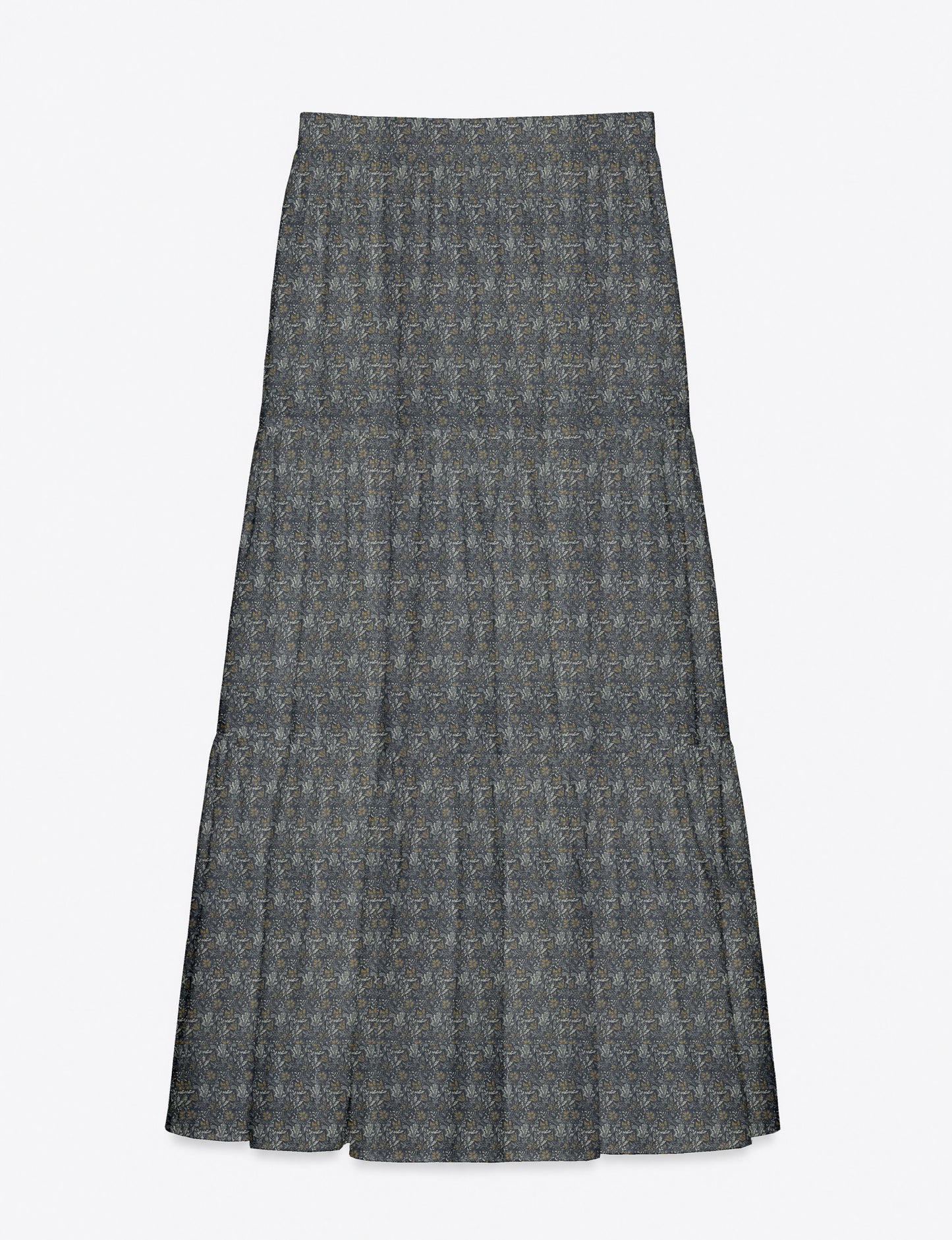 Woman wearing a yellow midi tiered skirt with a small geometric pattern, shown from the back, paired with beige top and