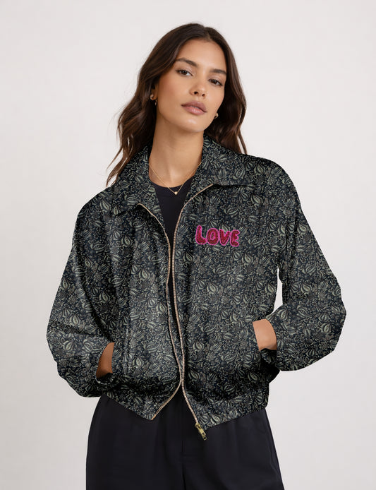 Love Bomber Jacket made from recycled fabric, featuring hand-stitched Aari embroidery. A unique piece of zero-waste clothing, part of the circular fashion movement. Designed with upcycled materials for a stylish yet environmentally friendly clothing choice.