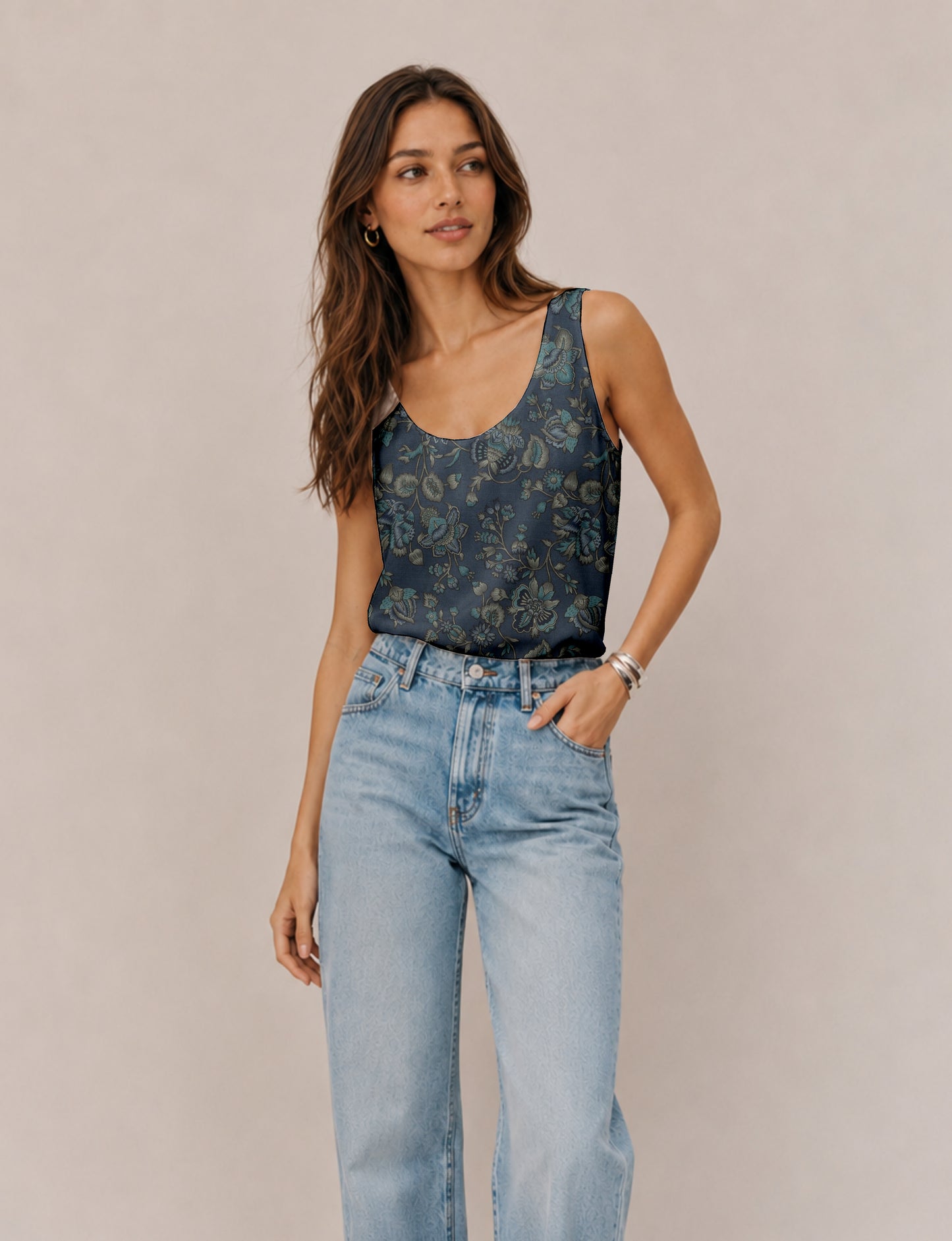 Women's sleeveless blouse with a relaxed straight fit, wide scoop neckline, deep scoop back, and hip-length silhouette.