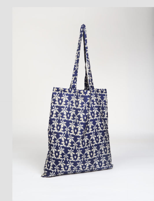 Colorful shopper bag made from recycled sari fabric, representing eco clothing, sustainable women's clothing, carbon neutral fashion, and repurposed clothing — ideal for environmentally friendly lifestyles and conscious clothing choices.