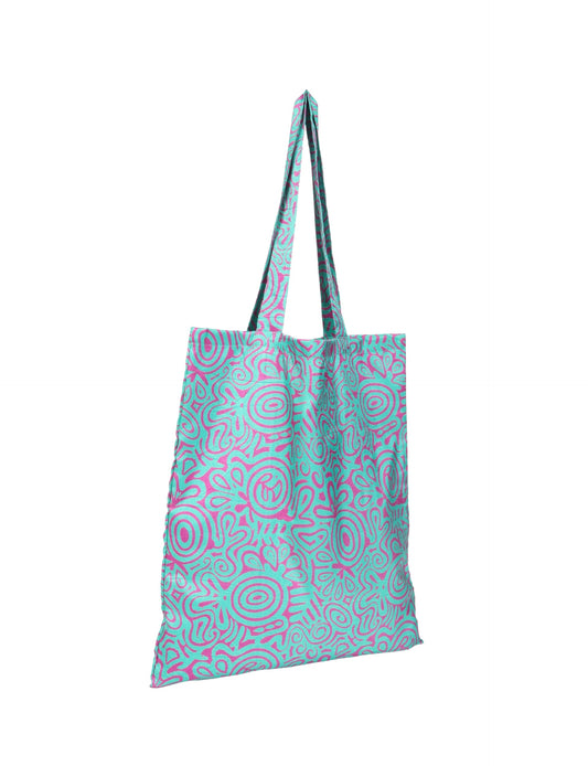 Colorful shopper bag made from recycled sari fabric, representing eco clothing, sustainable women's clothing, carbon neutral fashion, and repurposed clothing — ideal for environmentally friendly lifestyles and conscious clothing choices.