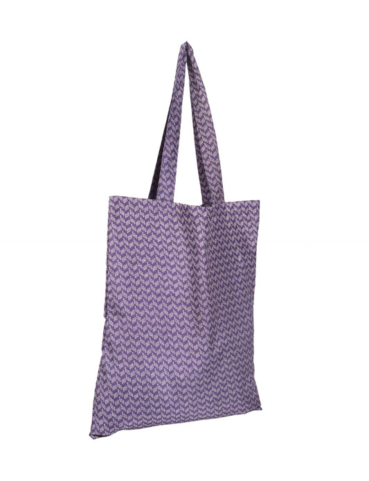 Colorful shopper bag made from recycled sari fabric, representing eco clothing, sustainable women's clothing, carbon neutral fashion, and repurposed clothing — ideal for environmentally friendly lifestyles and conscious clothing choices.
