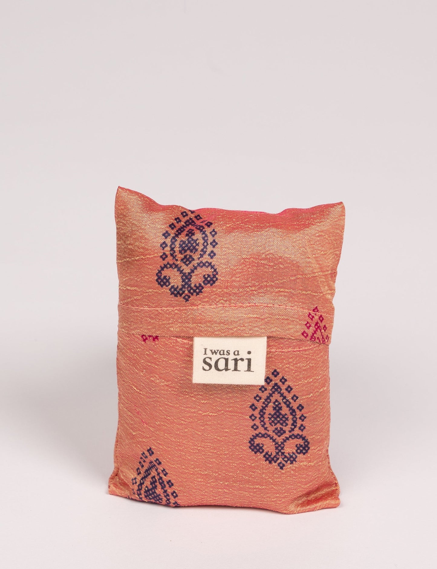 Stay eco-conscious with our Reusable Bag, handmade by Indian artisans from pre-loved saris. Silky and lightweight, this foldaway bag is perfect for your on-the-go lifestyle. Each piece is a unique statement of ethical fashion, embracing sustainability and style.