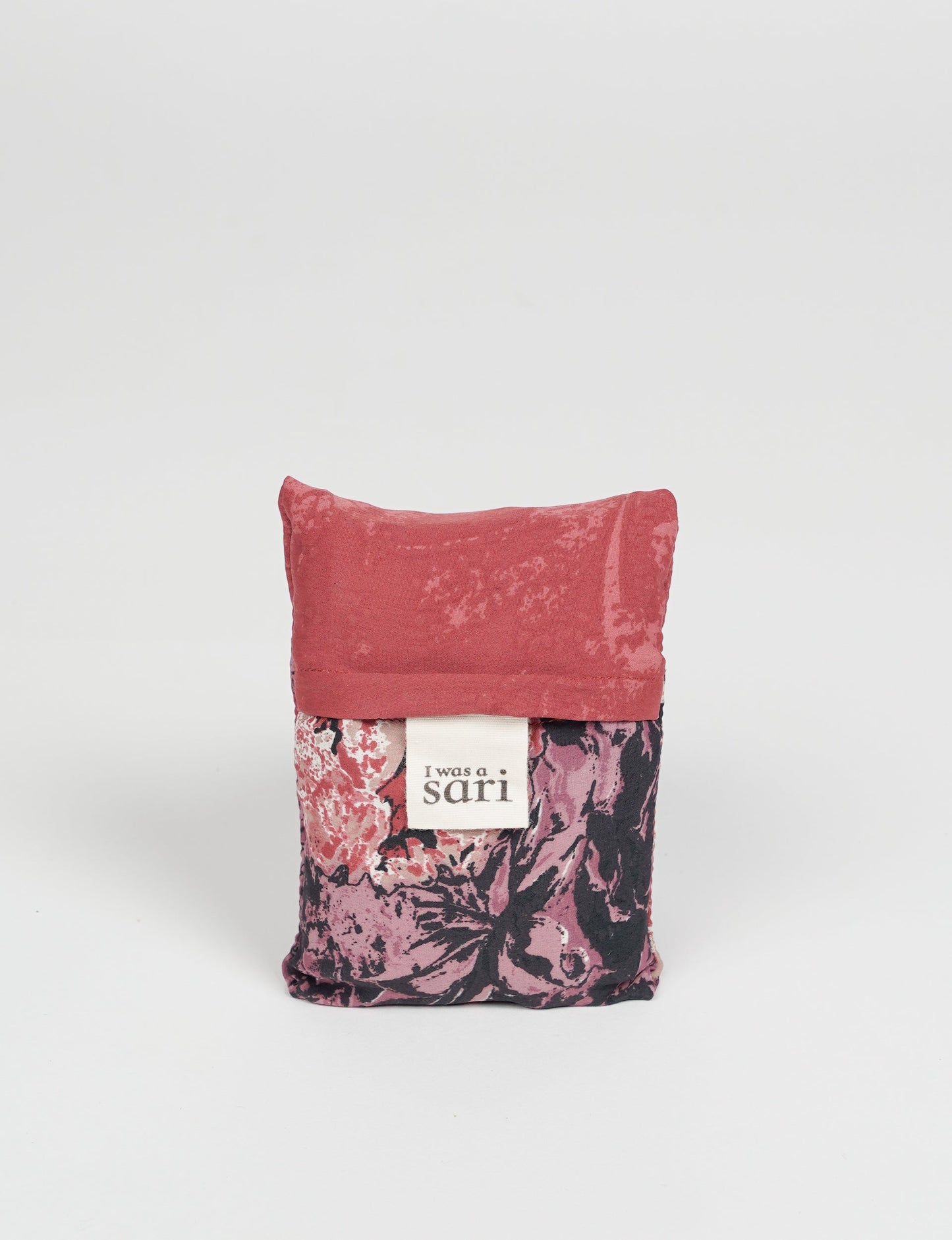 Stay eco-conscious with our Reusable Bag, handmade by Indian artisans from pre-loved saris. Silky and lightweight, this foldaway bag is perfect for your on-the-go lifestyle. Each piece is a unique statement of ethical fashion, embracing sustainability and style.