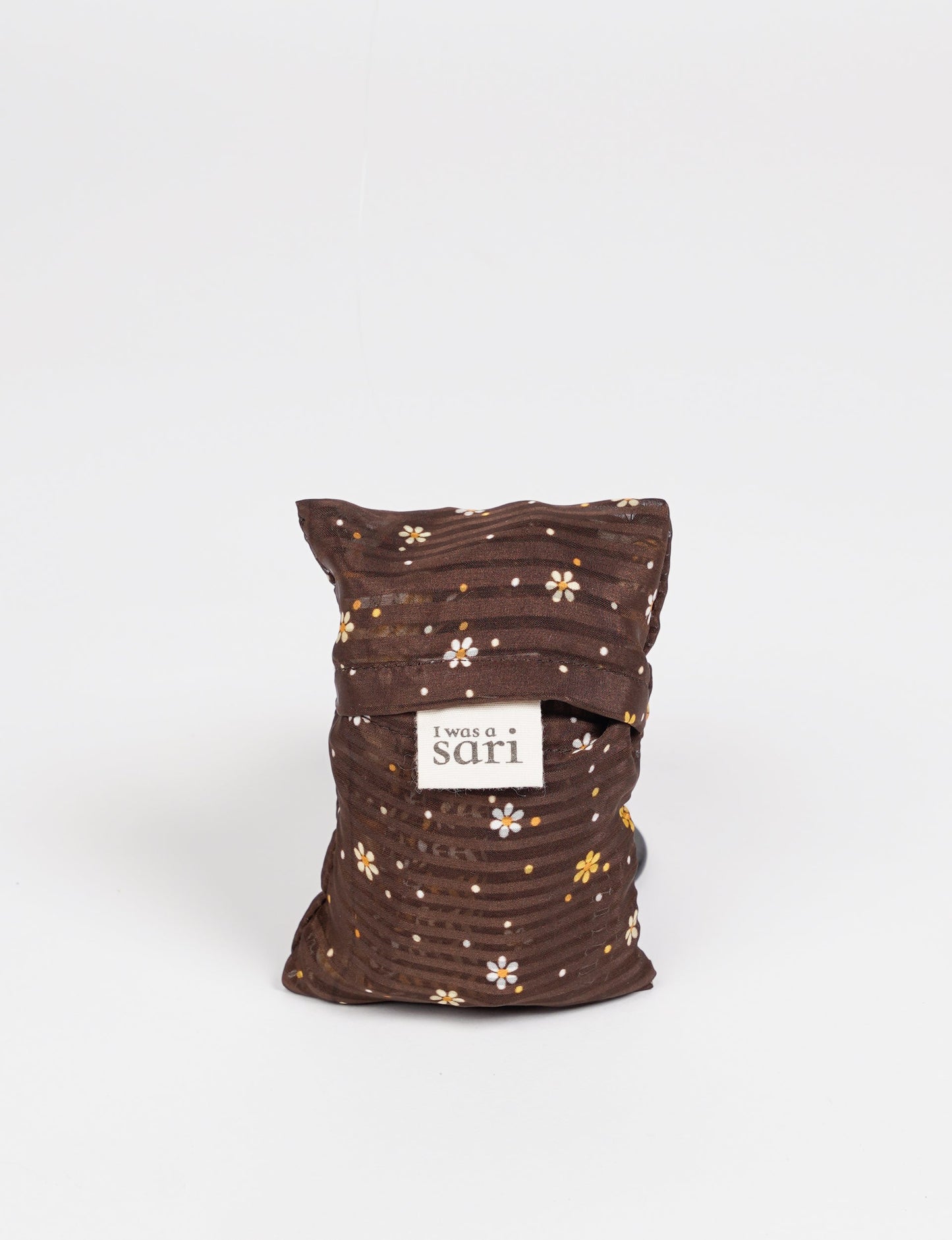 Stay eco-conscious with our Reusable Bag, handmade by Indian artisans from pre-loved saris. Silky and lightweight, this foldaway bag is perfect for your on-the-go lifestyle. Each piece is a unique statement of ethical fashion, embracing sustainability and style.