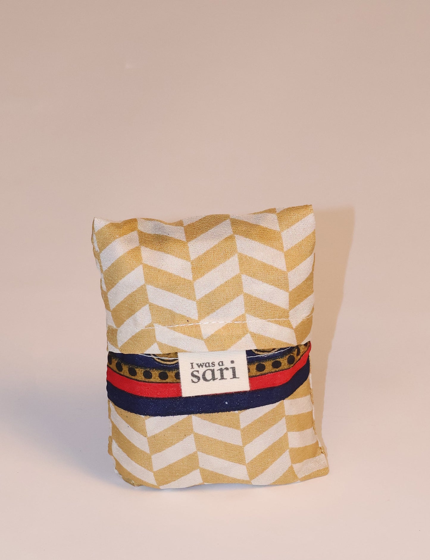 Stay eco-conscious with our Reusable Bag, handmade by Indian artisans from pre-loved saris. Silky and lightweight, this foldaway bag is perfect for your on-the-go lifestyle. Each piece is a unique statement of ethical fashion, embracing sustainability and style.