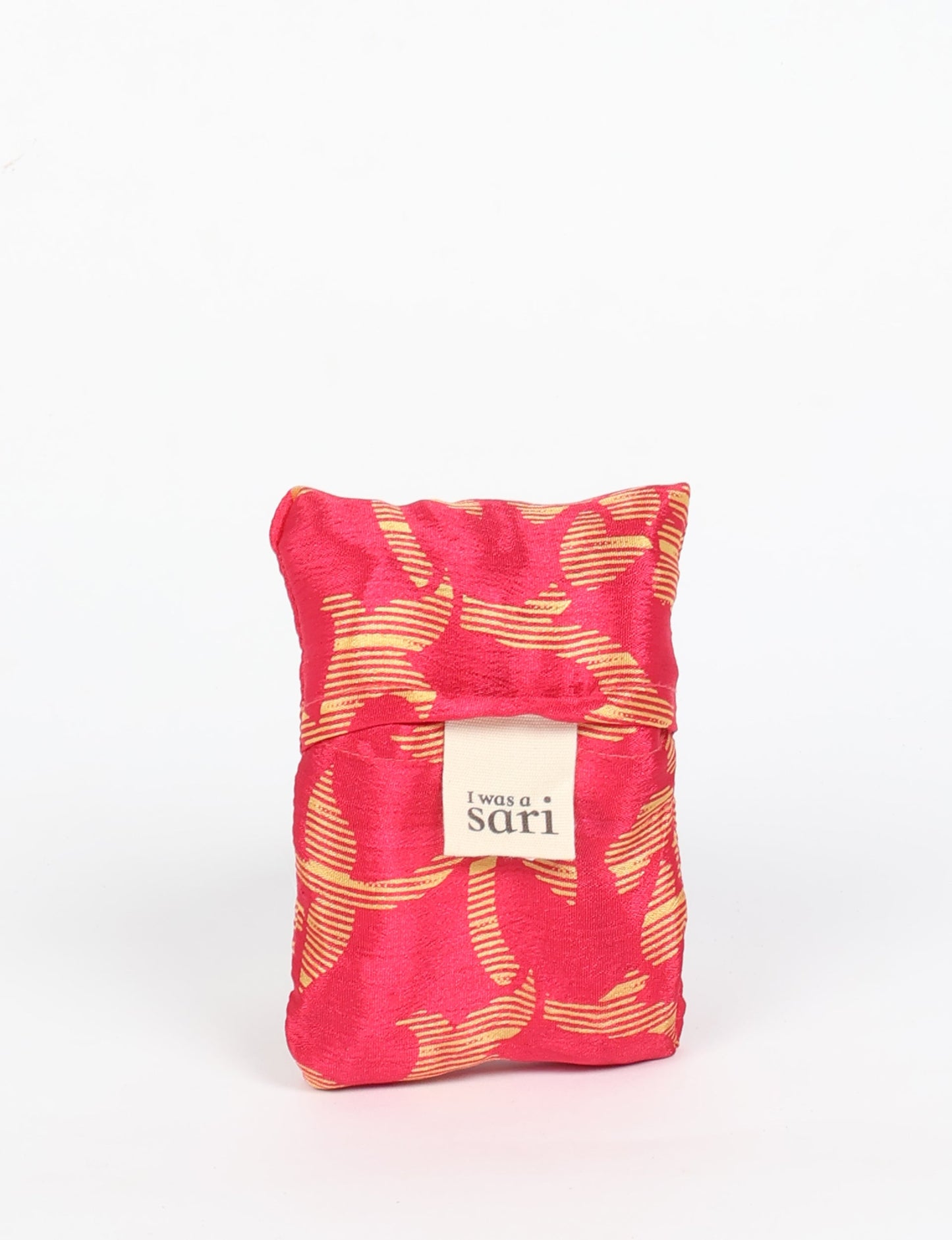 Stay eco-conscious with our Reusable Bag, handmade by Indian artisans from pre-loved saris. Silky and lightweight, this foldaway bag is perfect for your on-the-go lifestyle. Each piece is a unique statement of ethical fashion, embracing sustainability and style.