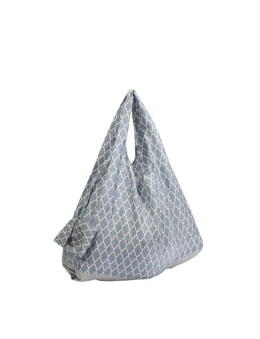 Stay eco-conscious with our Reusable Bag, handmade by Indian artisans from pre-loved saris. Silky and lightweight, this foldaway bag is perfect for your on-the-go lifestyle. Each piece is a unique statement of ethical fashion, embracing sustainability and style.