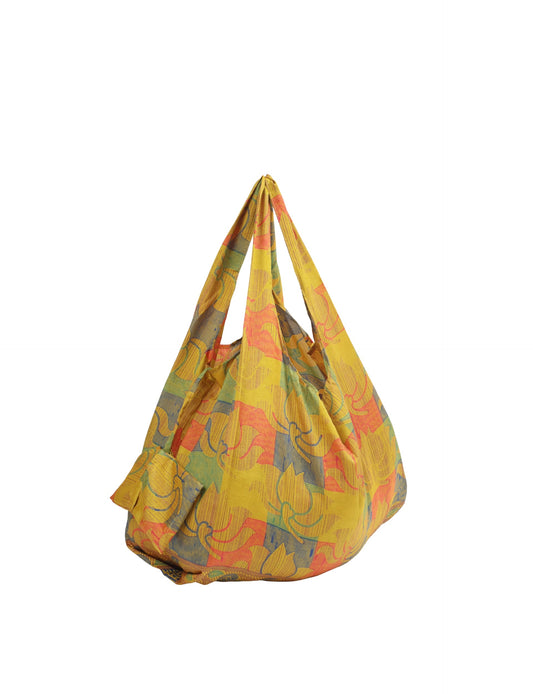 Stay eco-conscious with our Reusable Bag, handmade by Indian artisans from pre-loved saris. Silky and lightweight, this foldaway bag is perfect for your on-the-go lifestyle. Each piece is a unique statement of ethical fashion, embracing sustainability and style.