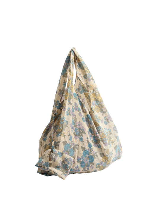 Stay eco-conscious with our Reusable Bag, handmade by Indian artisans from pre-loved saris. Silky and lightweight, this foldaway bag is perfect for your on-the-go lifestyle. Each piece is a unique statement of ethical fashion, embracing sustainability and style.