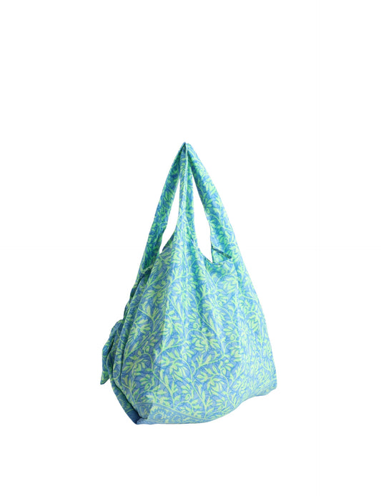 Stay eco-conscious with our Reusable Bag, handmade by Indian artisans from pre-loved saris. Silky and lightweight, this foldaway bag is perfect for your on-the-go lifestyle. Each piece is a unique statement of ethical fashion, embracing sustainability and style.