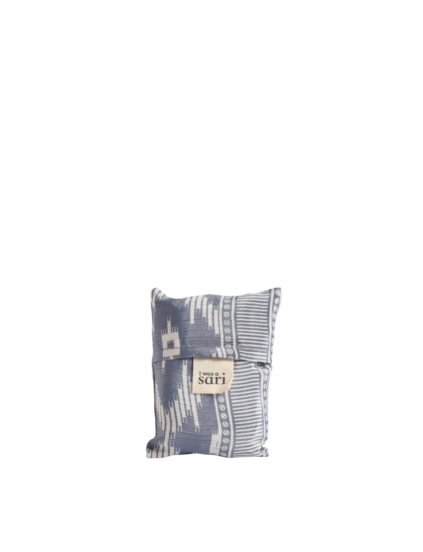 Stay eco-conscious with our Reusable Bag, handmade by Indian artisans from pre-loved saris. Silky and lightweight, this foldaway bag is perfect for your on-the-go lifestyle. Each piece is a unique statement of ethical fashion, embracing sustainability and style.