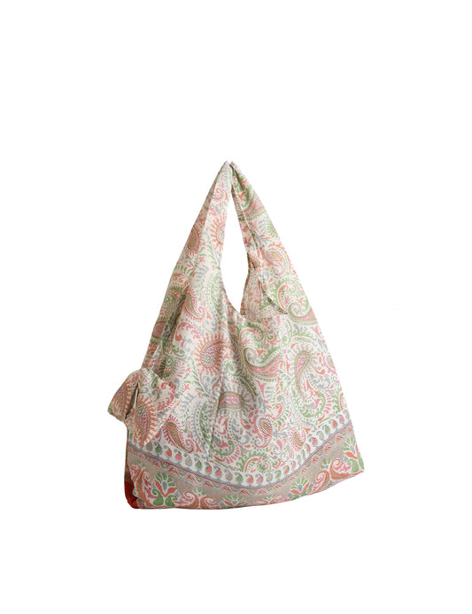 Stay eco-conscious with our Reusable Bag, handmade by Indian artisans from pre-loved saris. Silky and lightweight, this foldaway bag is perfect for your on-the-go lifestyle. Each piece is a unique statement of ethical fashion, embracing sustainability and style.