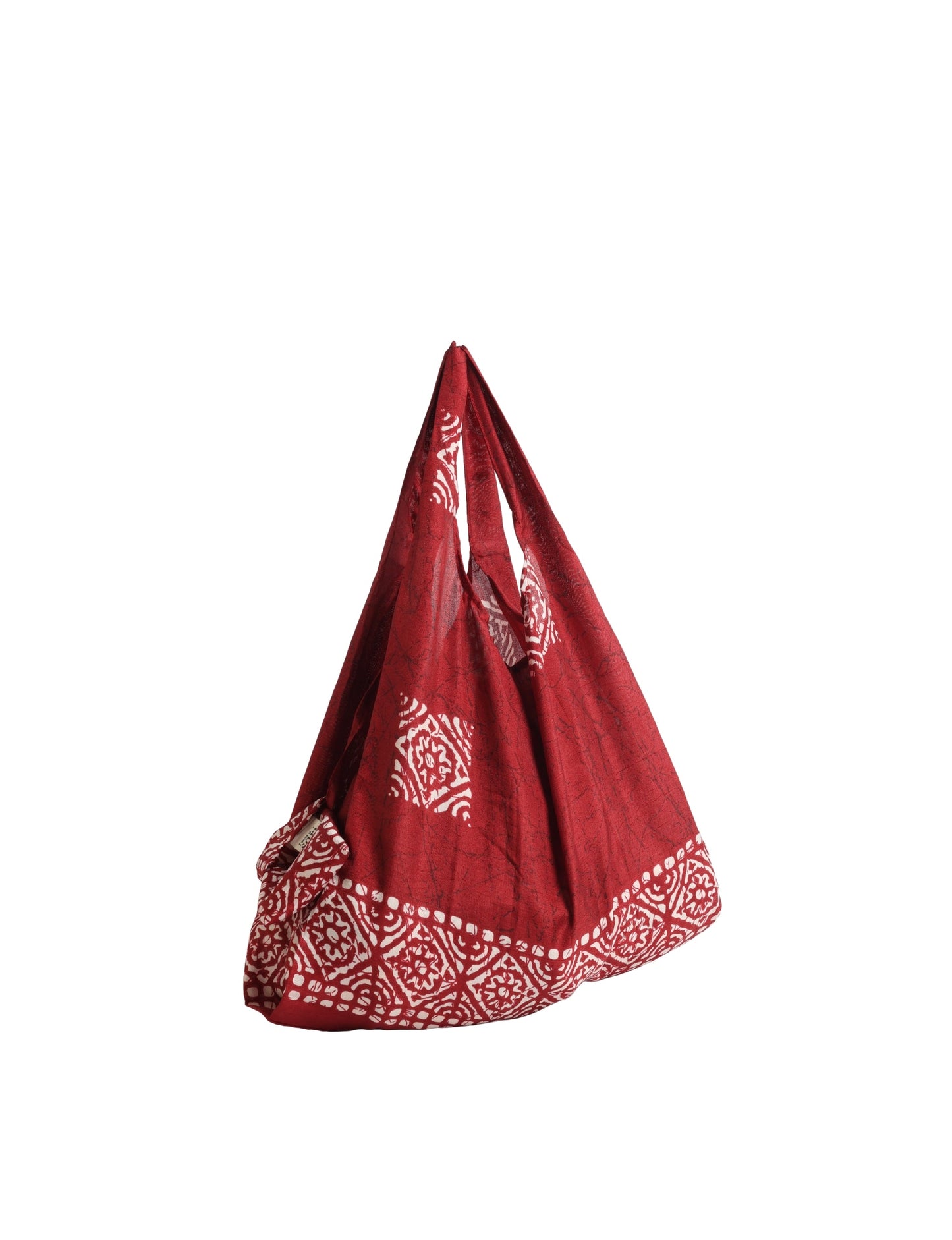 Stay eco-conscious with our Reusable Bag, handmade by Indian artisans from pre-loved saris. Silky and lightweight, this foldaway bag is perfect for your on-the-go lifestyle. Each piece is a unique statement of ethical fashion, embracing sustainability and style.