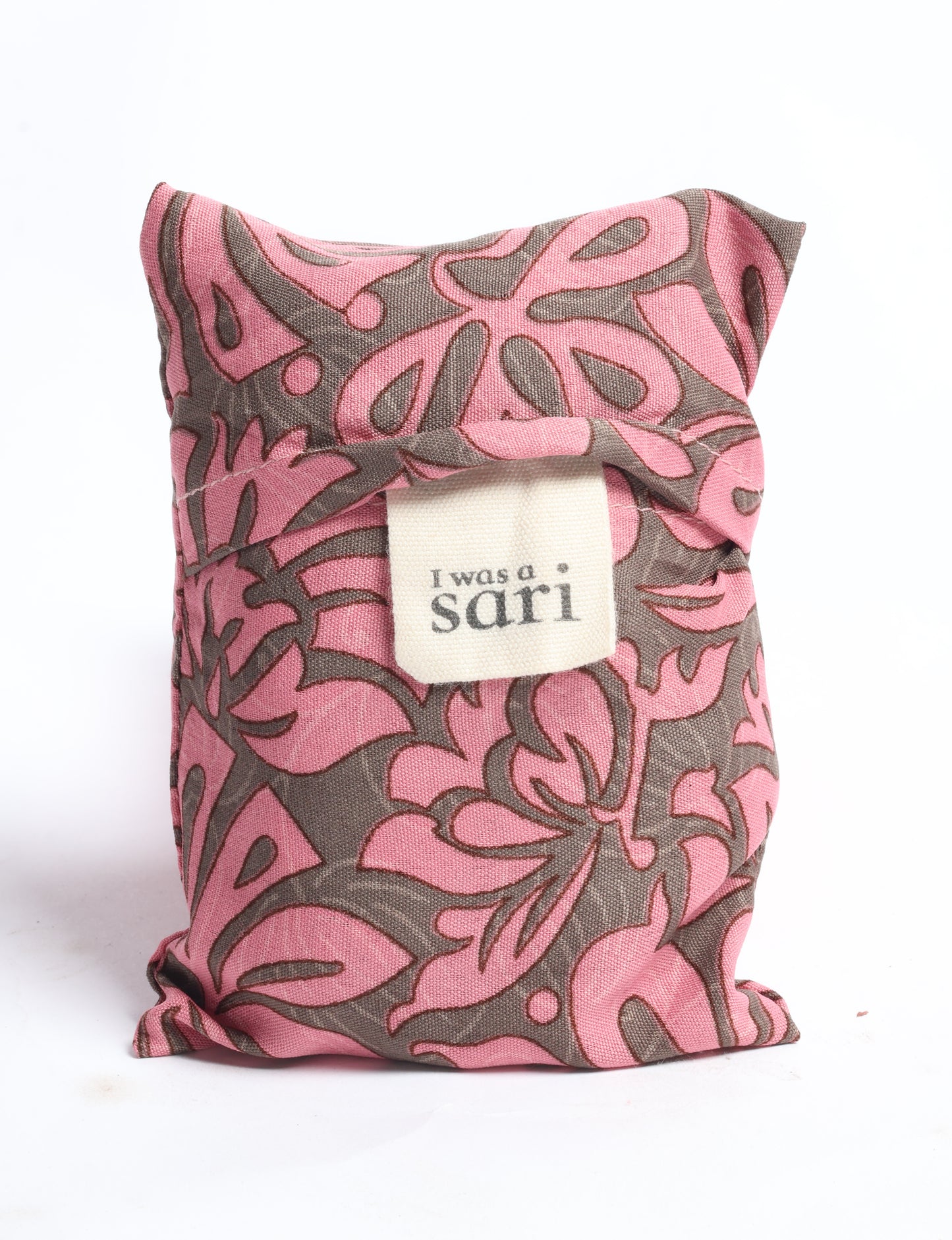 Stay eco-conscious with our Reusable Bag, handmade by Indian artisans from pre-loved saris. Silky and lightweight, this foldaway bag is perfect for your on-the-go lifestyle. Each piece is a unique statement of ethical fashion, embracing sustainability and style.