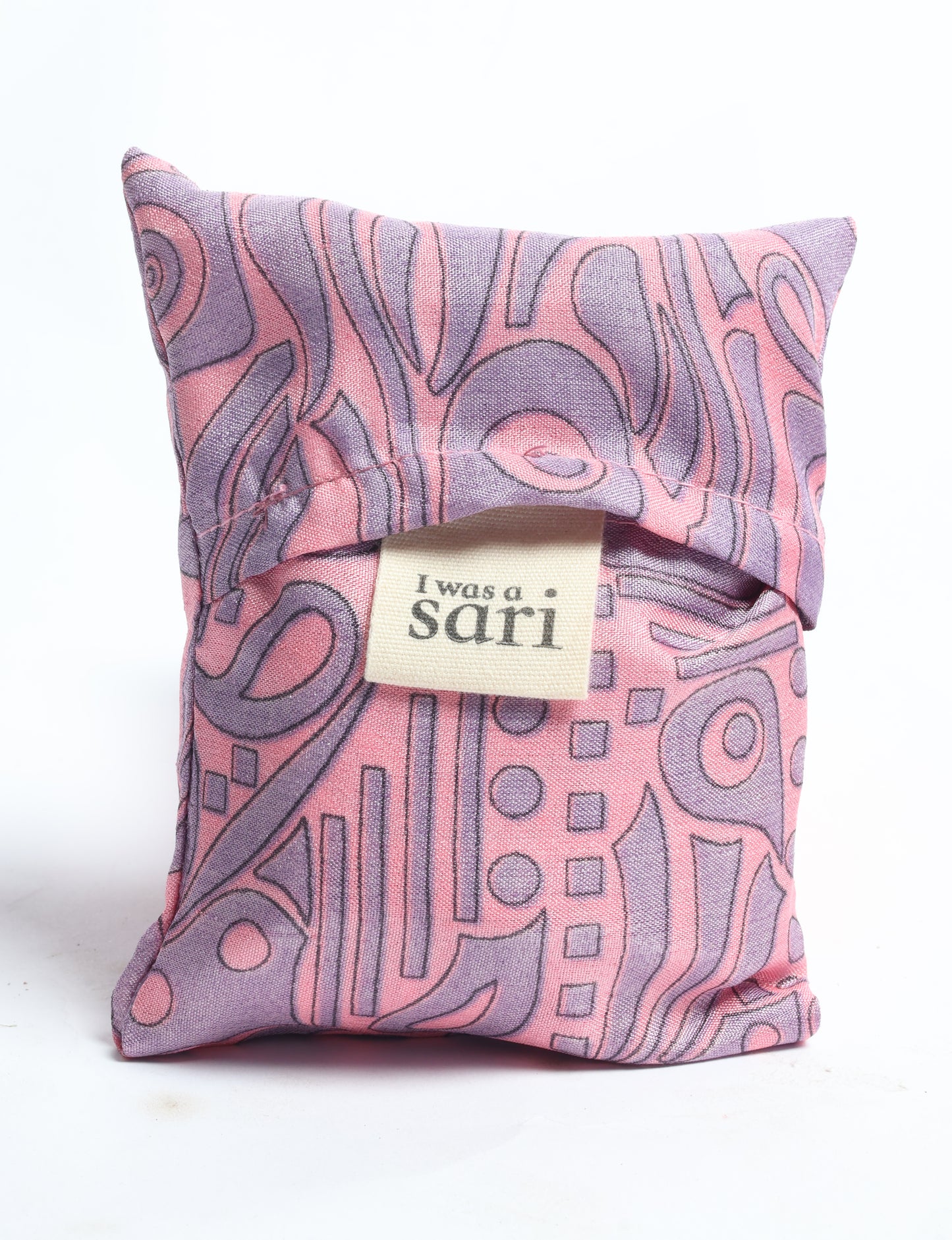 Stay eco-conscious with our Reusable Bag, handmade by Indian artisans from pre-loved saris. Silky and lightweight, this foldaway bag is perfect for your on-the-go lifestyle. Each piece is a unique statement of ethical fashion, embracing sustainability and style.