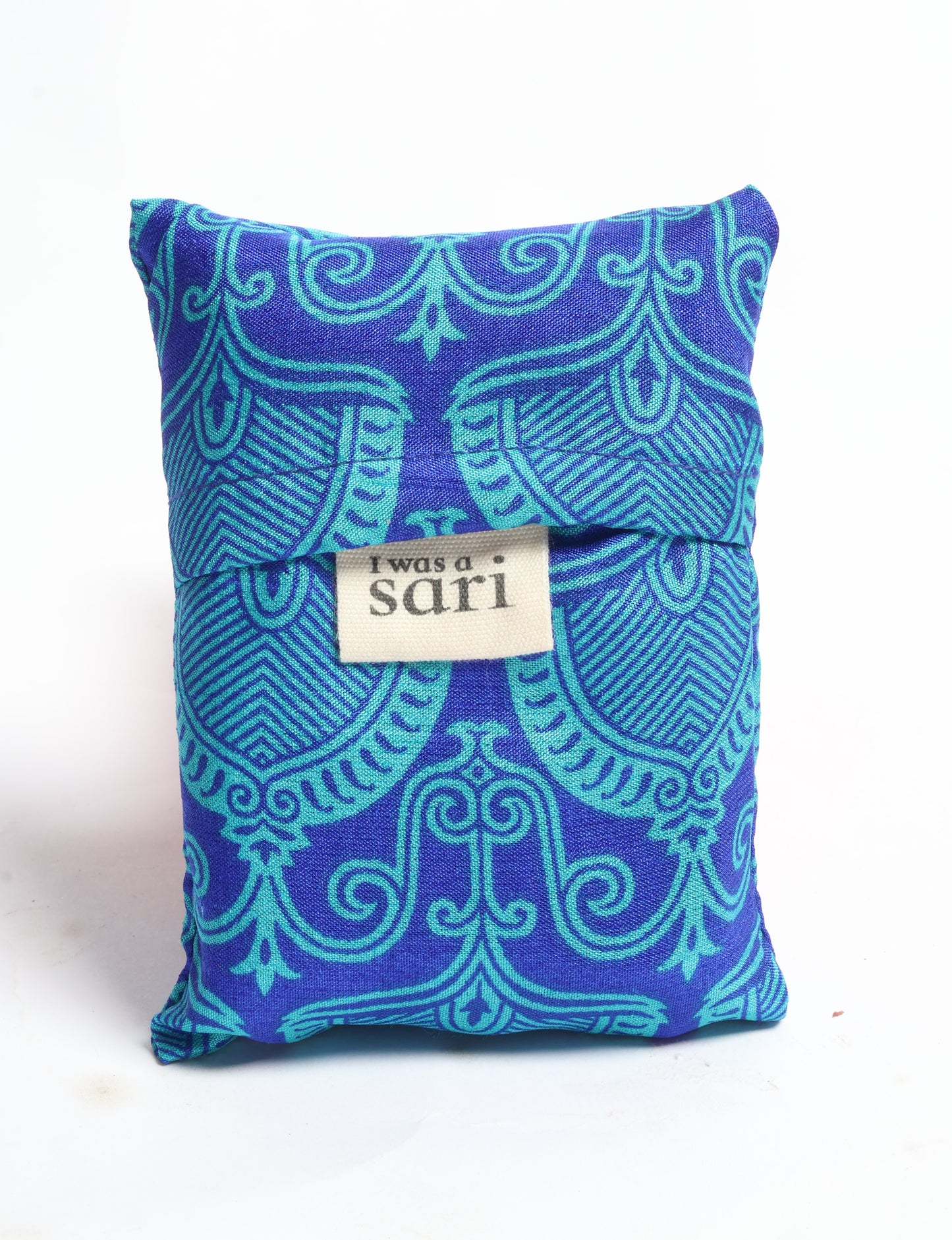 Stay eco-conscious with our Reusable Bag, handmade by Indian artisans from pre-loved saris. Silky and lightweight, this foldaway bag is perfect for your on-the-go lifestyle. Each piece is a unique statement of ethical fashion, embracing sustainability and style.