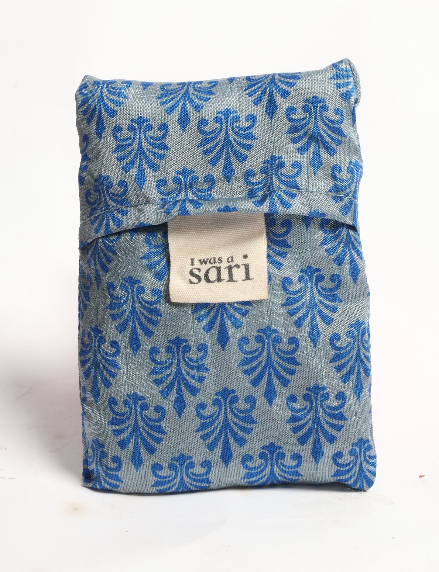 Stay eco-conscious with our Reusable Bag, handmade by Indian artisans from pre-loved saris. Silky and lightweight, this foldaway bag is perfect for your on-the-go lifestyle. Each piece is a unique statement of ethical fashion, embracing sustainability and style.