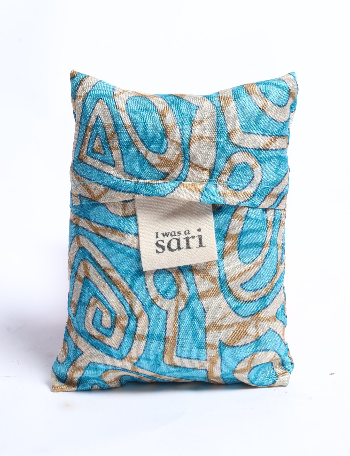 Stay eco-conscious with our Reusable Bag, handmade by Indian artisans from pre-loved saris. Silky and lightweight, this foldaway bag is perfect for your on-the-go lifestyle. Each piece is a unique statement of ethical fashion, embracing sustainability and style.