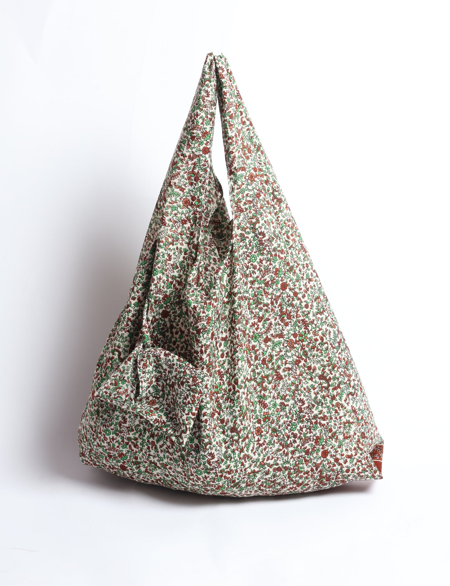Stay eco-conscious with our Reusable Bag, handmade by Indian artisans from pre-loved saris. Silky and lightweight, this foldaway bag is perfect for your on-the-go lifestyle. Each piece is a unique statement of ethical fashion, embracing sustainability and style.