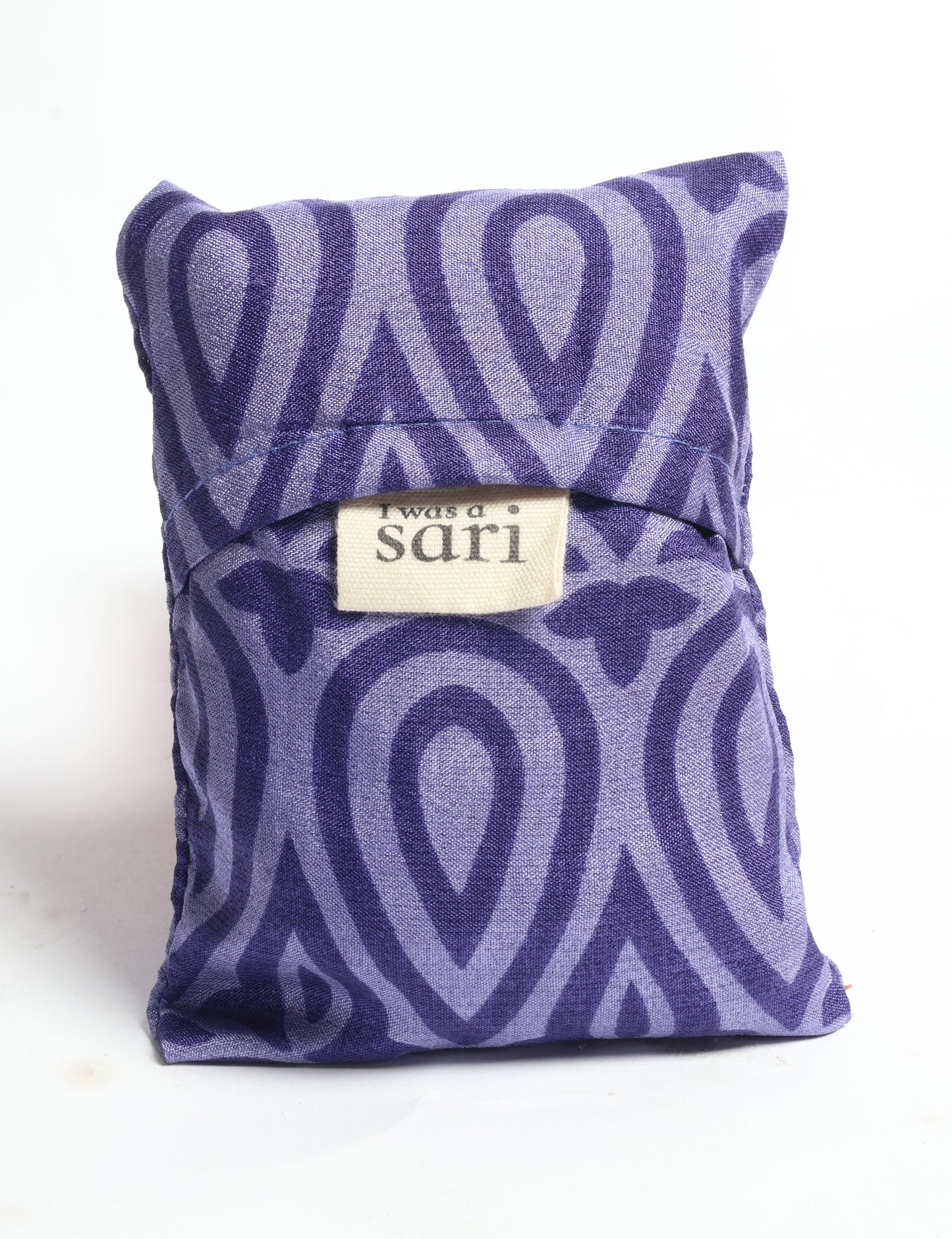 Stay eco-conscious with our Reusable Bag, handmade by Indian artisans from pre-loved saris. Silky and lightweight, this foldaway bag is perfect for your on-the-go lifestyle. Each piece is a unique statement of ethical fashion, embracing sustainability and style.