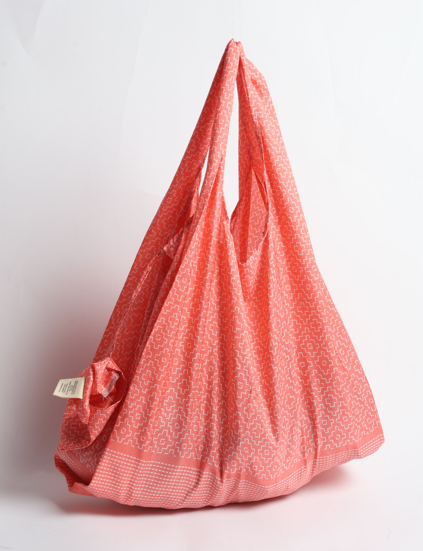 Stay eco-conscious with our Reusable Bag, handmade by Indian artisans from pre-loved saris. Silky and lightweight, this foldaway bag is perfect for your on-the-go lifestyle. Each piece is a unique statement of ethical fashion, embracing sustainability and style.