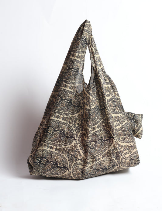 Stay eco-conscious with our Reusable Bag, handmade by Indian artisans from pre-loved saris. Silky and lightweight, this foldaway bag is perfect for your on-the-go lifestyle. Each piece is a unique statement of ethical fashion, embracing sustainability and style.
