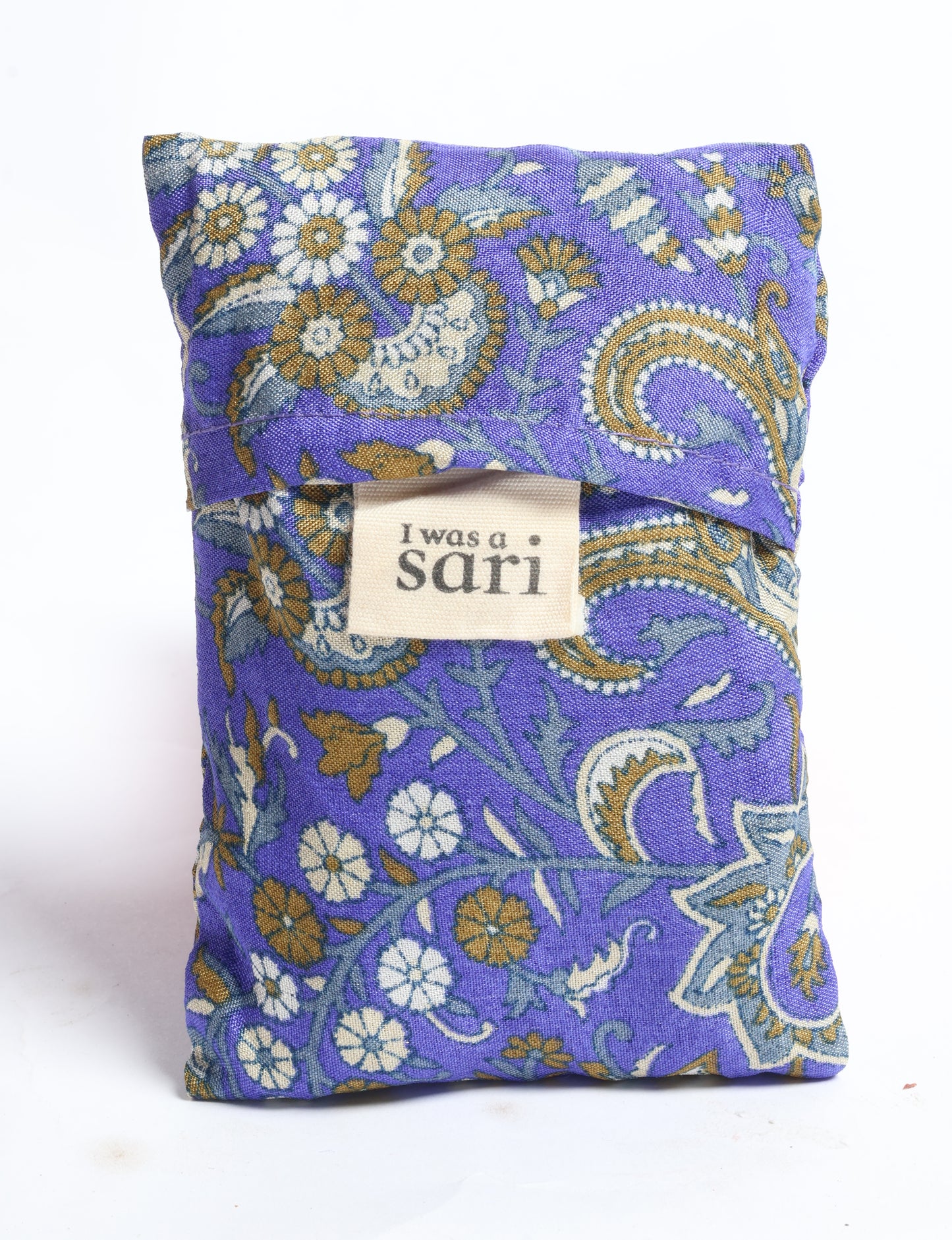 Stay eco-conscious with our Reusable Bag, handmade by Indian artisans from pre-loved saris. Silky and lightweight, this foldaway bag is perfect for your on-the-go lifestyle. Each piece is a unique statement of ethical fashion, embracing sustainability and style.