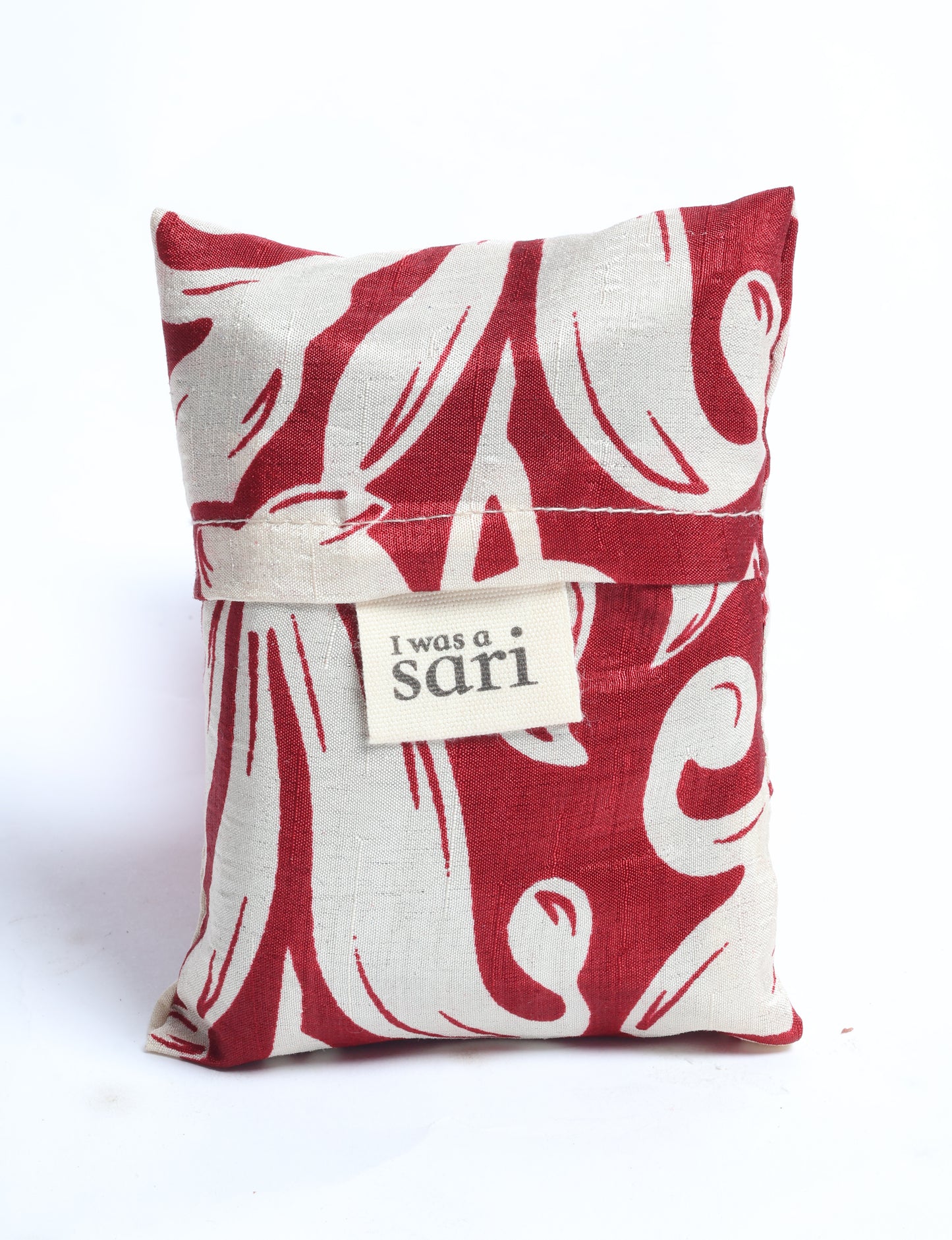 Stay eco-conscious with our Reusable Bag, handmade by Indian artisans from pre-loved saris. Silky and lightweight, this foldaway bag is perfect for your on-the-go lifestyle. Each piece is a unique statement of ethical fashion, embracing sustainability and style.