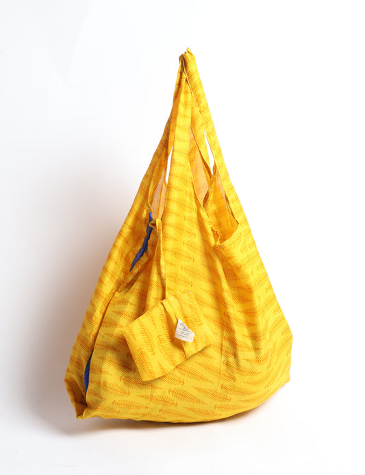 Stay eco-conscious with our Reusable Bag, handmade by Indian artisans from pre-loved saris. Silky and lightweight, this foldaway bag is perfect for your on-the-go lifestyle. Each piece is a unique statement of ethical fashion, embracing sustainability and style.