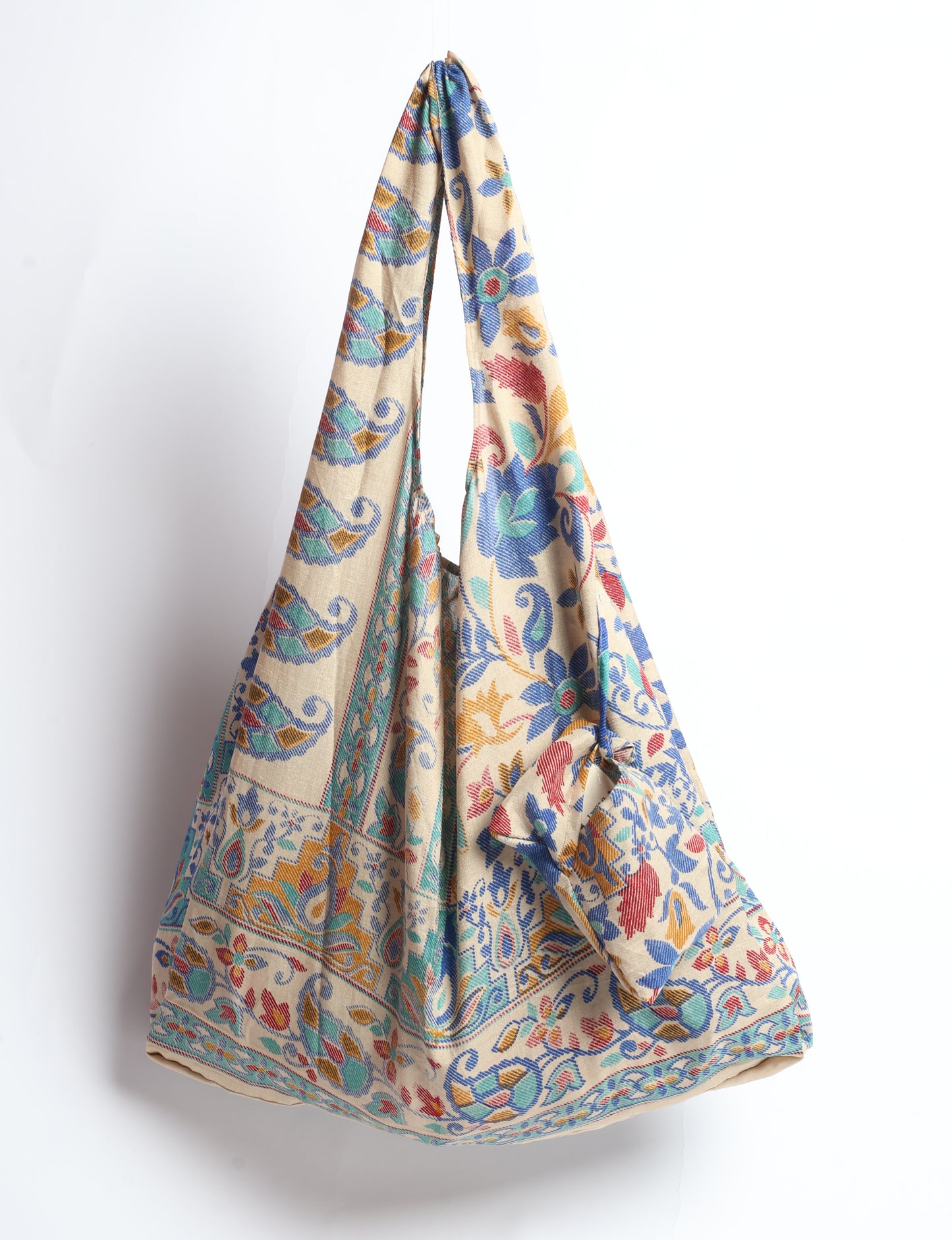 Stay eco-conscious with our Reusable Bag, handmade by Indian artisans from pre-loved saris. Silky and lightweight, this foldaway bag is perfect for your on-the-go lifestyle. Each piece is a unique statement of ethical fashion, embracing sustainability and style.