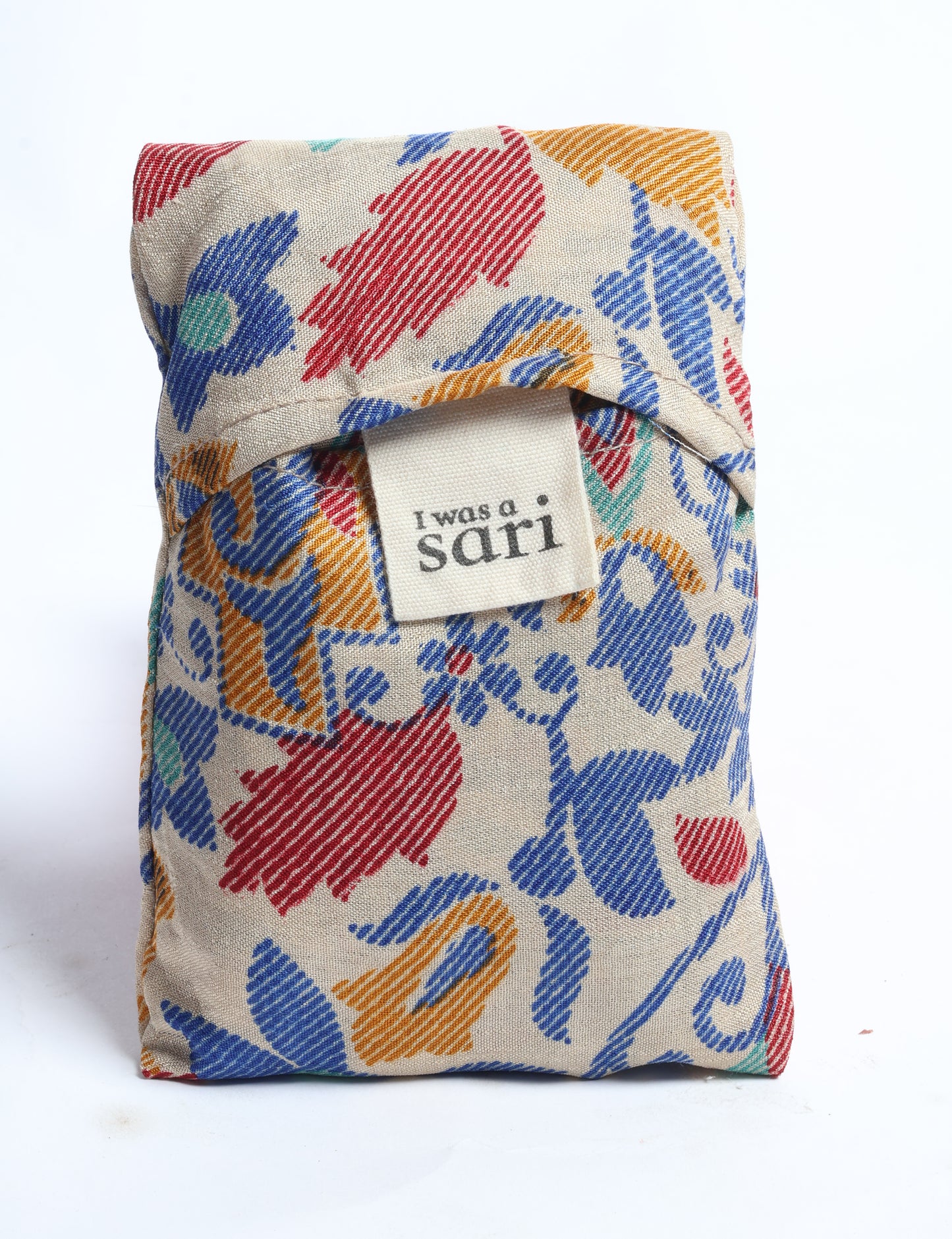 Stay eco-conscious with our Reusable Bag, handmade by Indian artisans from pre-loved saris. Silky and lightweight, this foldaway bag is perfect for your on-the-go lifestyle. Each piece is a unique statement of ethical fashion, embracing sustainability and style.